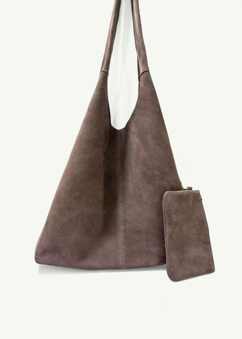 Brown suede handbag with matching pouch on a white background