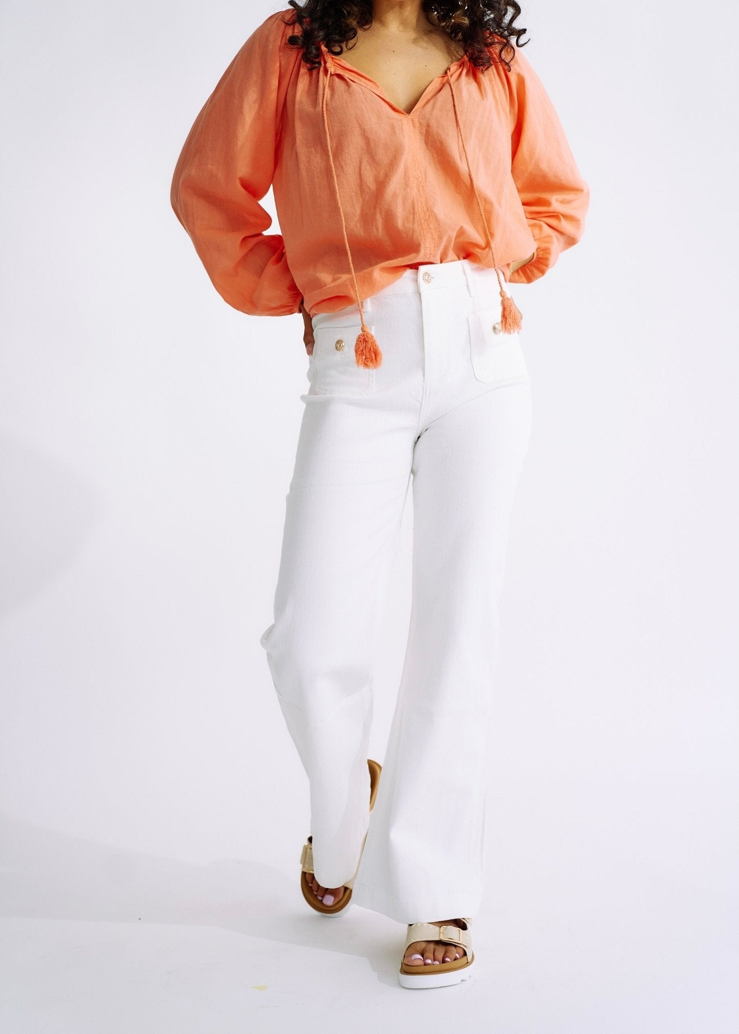 View our High Waisted Flared Jeans in White - The ultimate BOTTOMS created by TRIBUTE and sold here, at Tribute Store