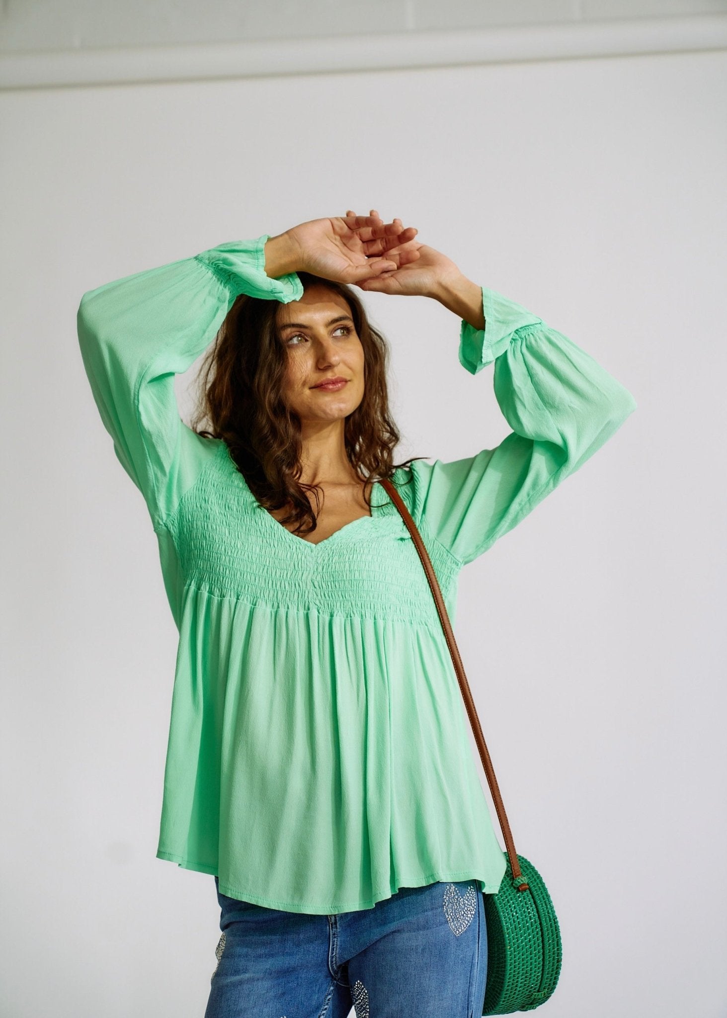 View our Italian Smock V Neck Blouse in Green - The ultimate TOPS created by TRIBUTE and sold here, at Tribute Store