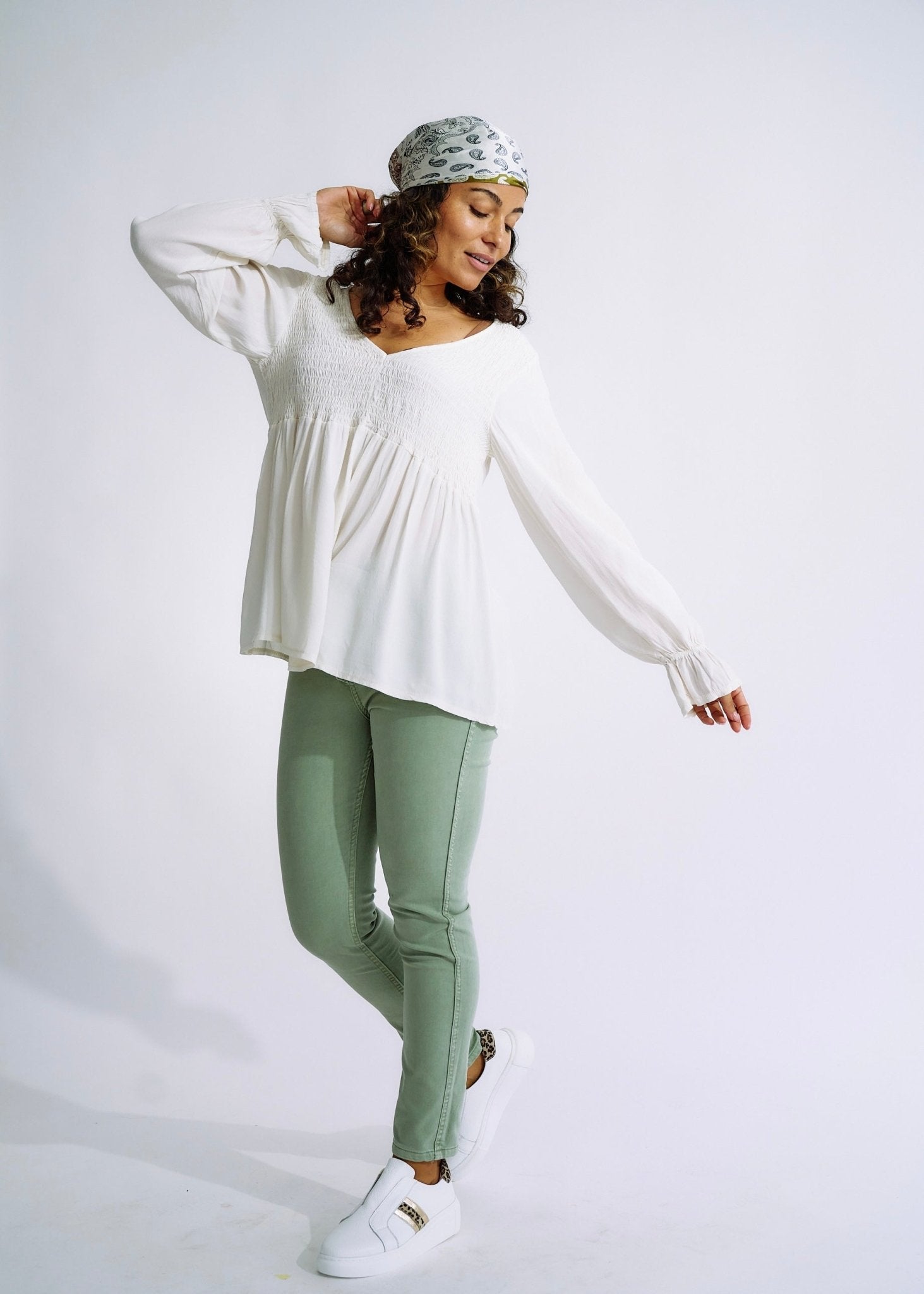 View our Italian Smock V Neck Blouse in Off White - The ultimate TOPS created by TRIBUTE and sold here, at Tribute Store