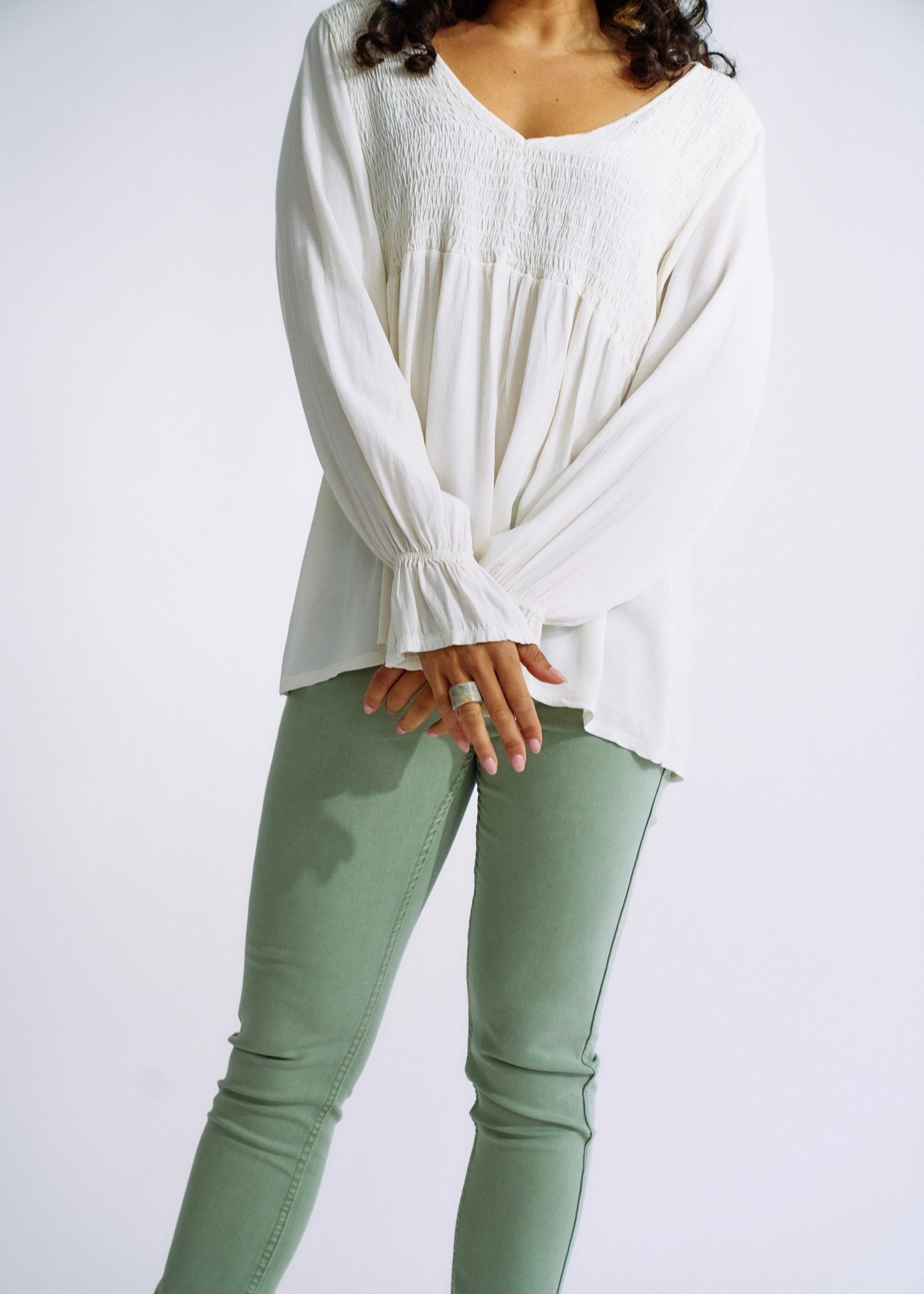 View our Italian Smock V Neck Blouse in Off White - The ultimate TOPS created by TRIBUTE and sold here, at Tribute Store