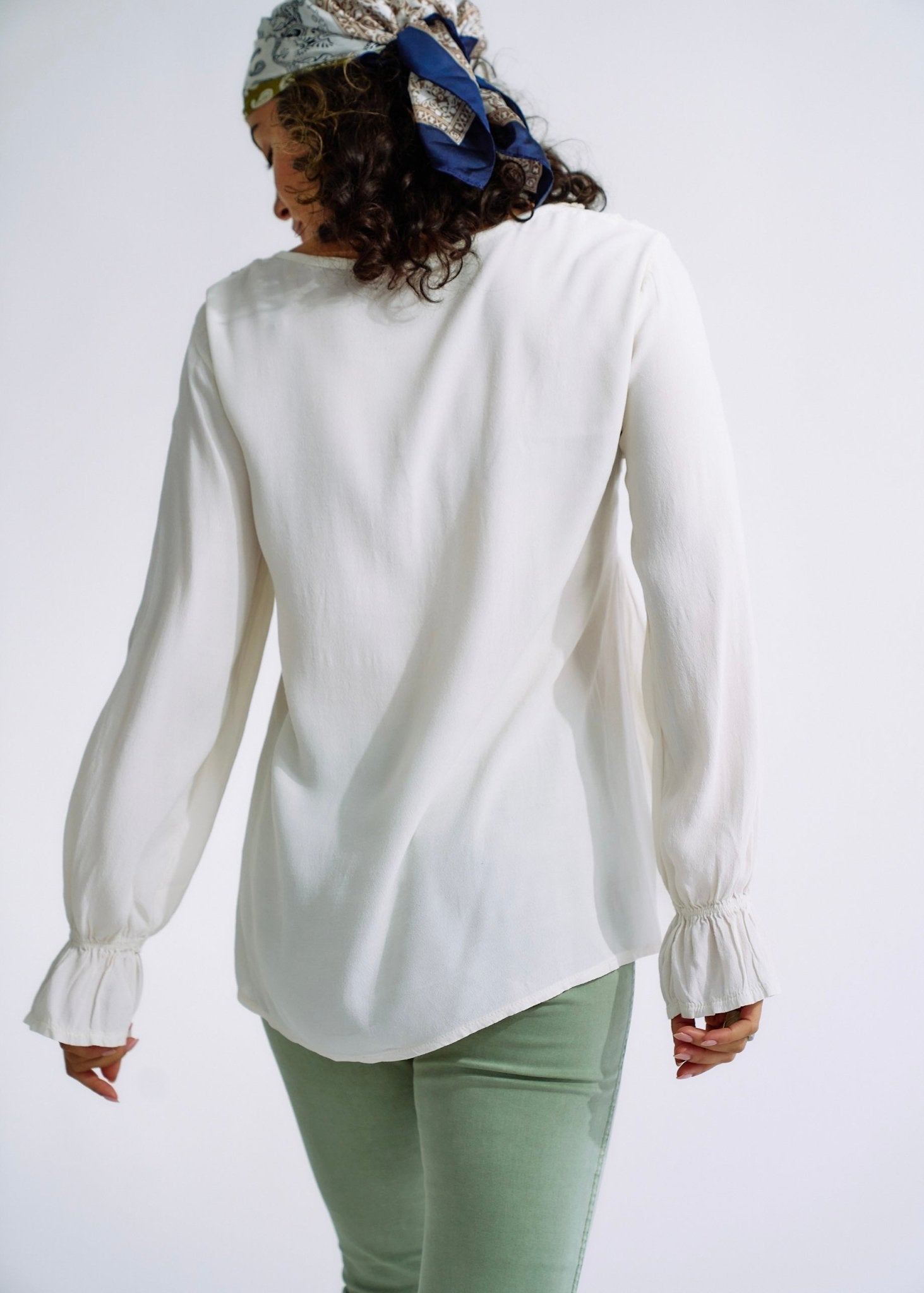 View our Italian Smock V Neck Blouse in Off White - The ultimate TOPS created by TRIBUTE and sold here, at Tribute Store