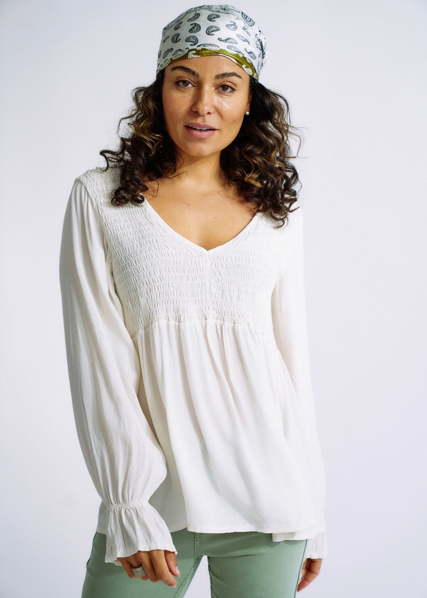 View our Italian Smock V Neck Blouse in Off White - The ultimate TOPS created by TRIBUTE and sold here, at Tribute Store