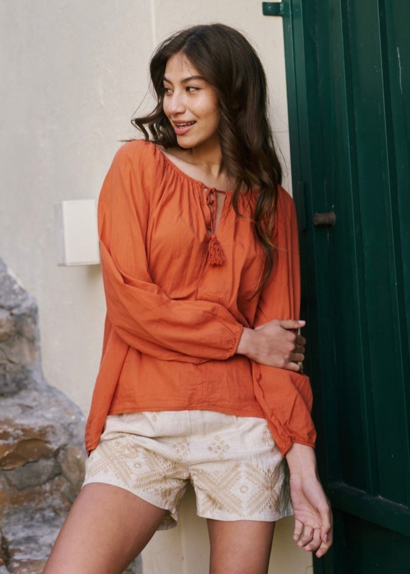 View our Italian Stonewashed Peasant Blouse in Rust - The ultimate TOPS created by TRIBUTE and sold here, at Tribute Store