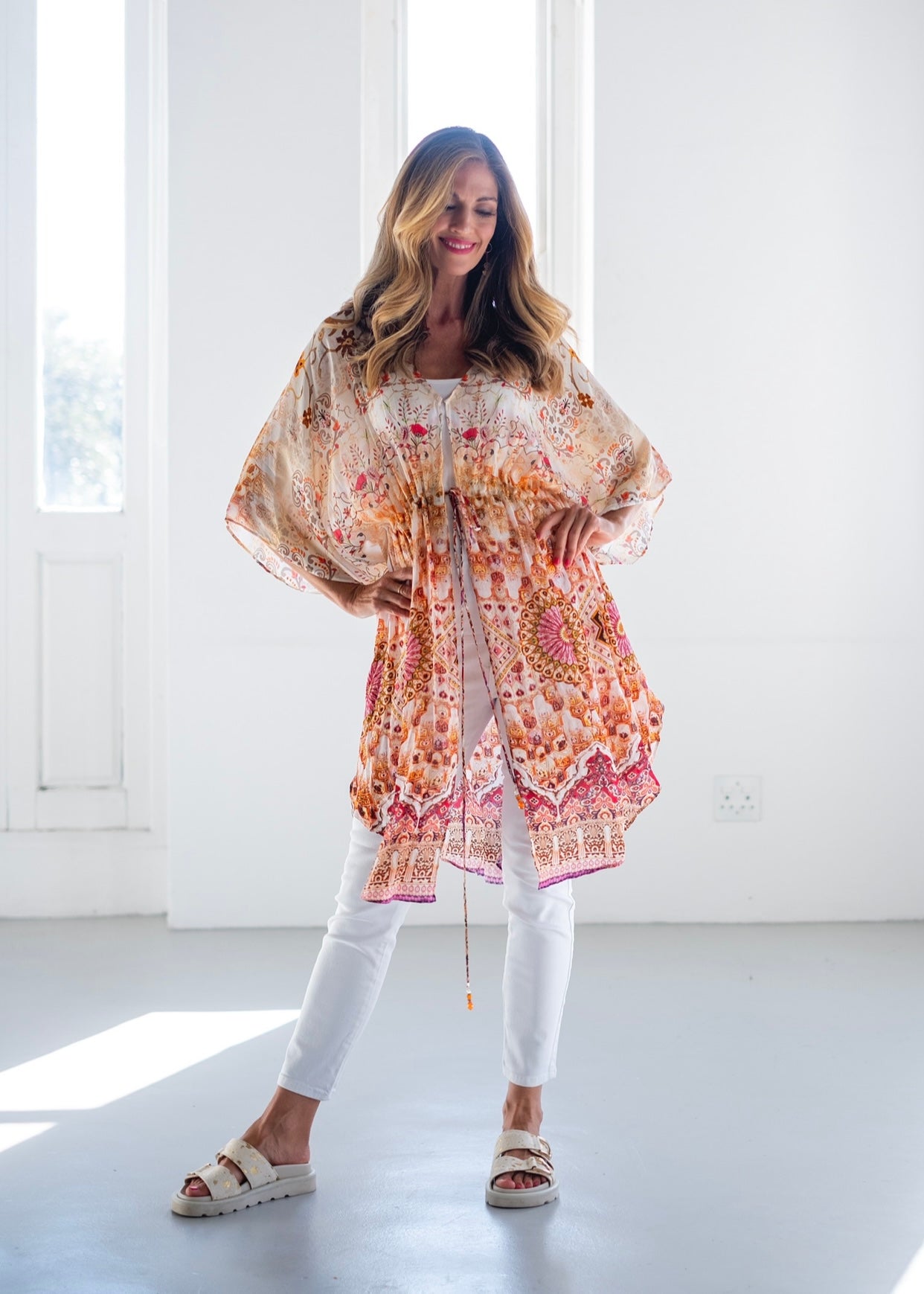 View our Lara Kaftan With Flower Print In Soft Peach - The ultimate DRESSES created by ICONIC and sold here, at Tribute Store