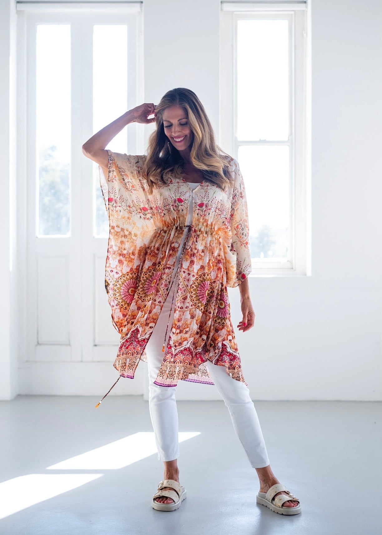 View our Lara Kaftan With Flower Print In Soft Peach - The ultimate DRESSES created by ICONIC and sold here, at Tribute Store