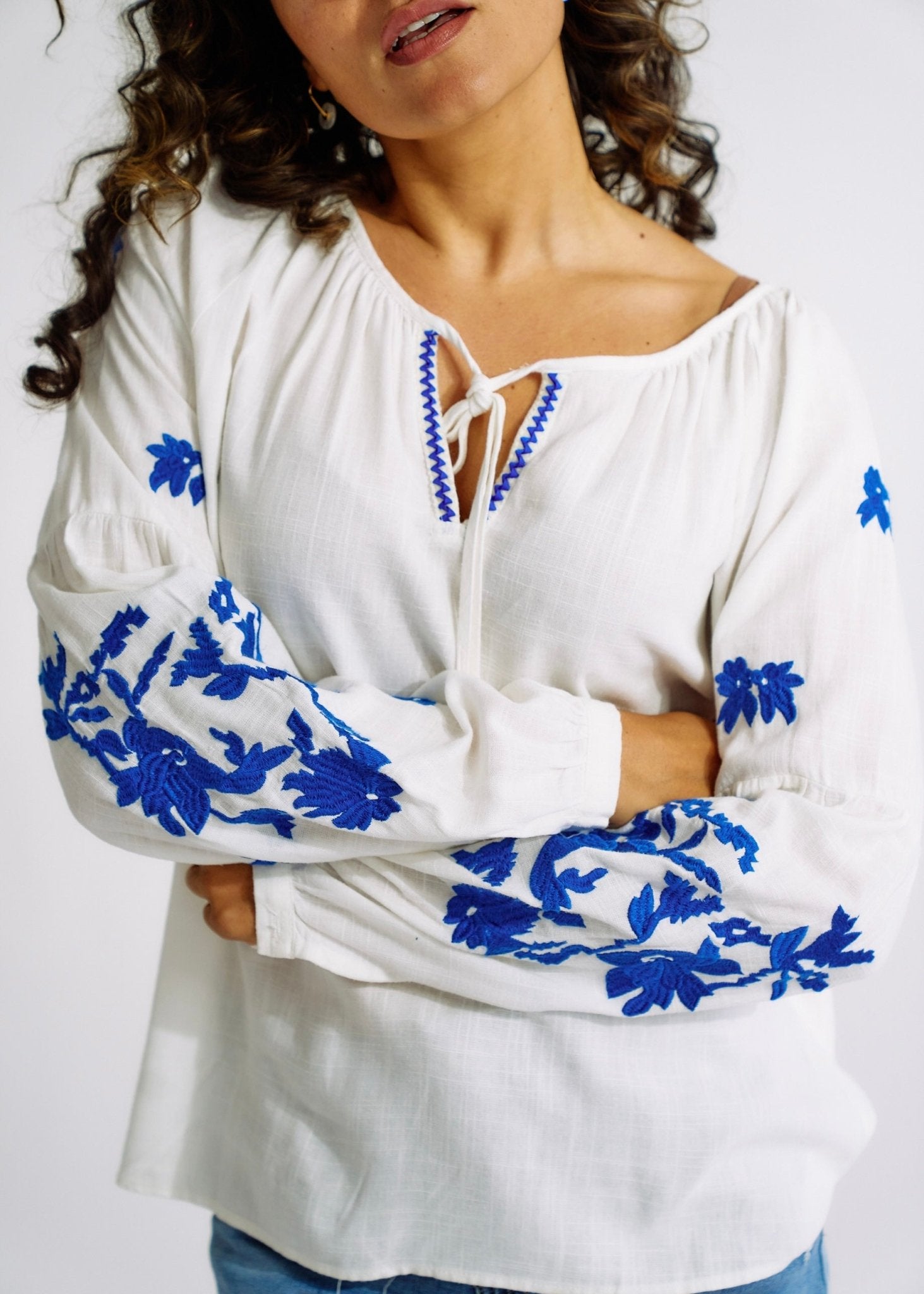 View our Linen Blend Peasant Blouse with Navy Embroidery - The ultimate TOPS created by TRIBUTE and sold here, at Tribute Store