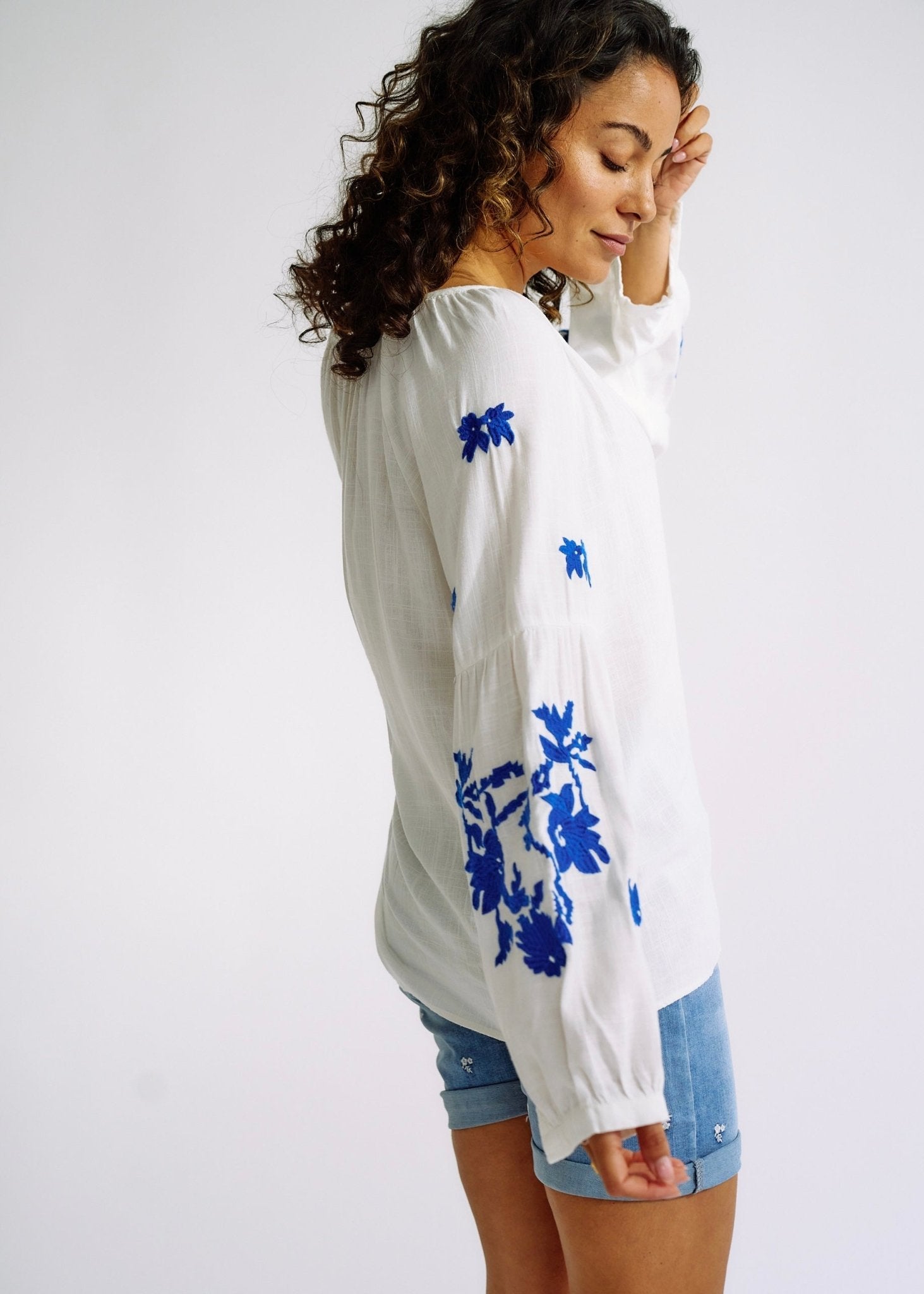 View our Linen Blend Peasant Blouse with Navy Embroidery - The ultimate TOPS created by TRIBUTE and sold here, at Tribute Store