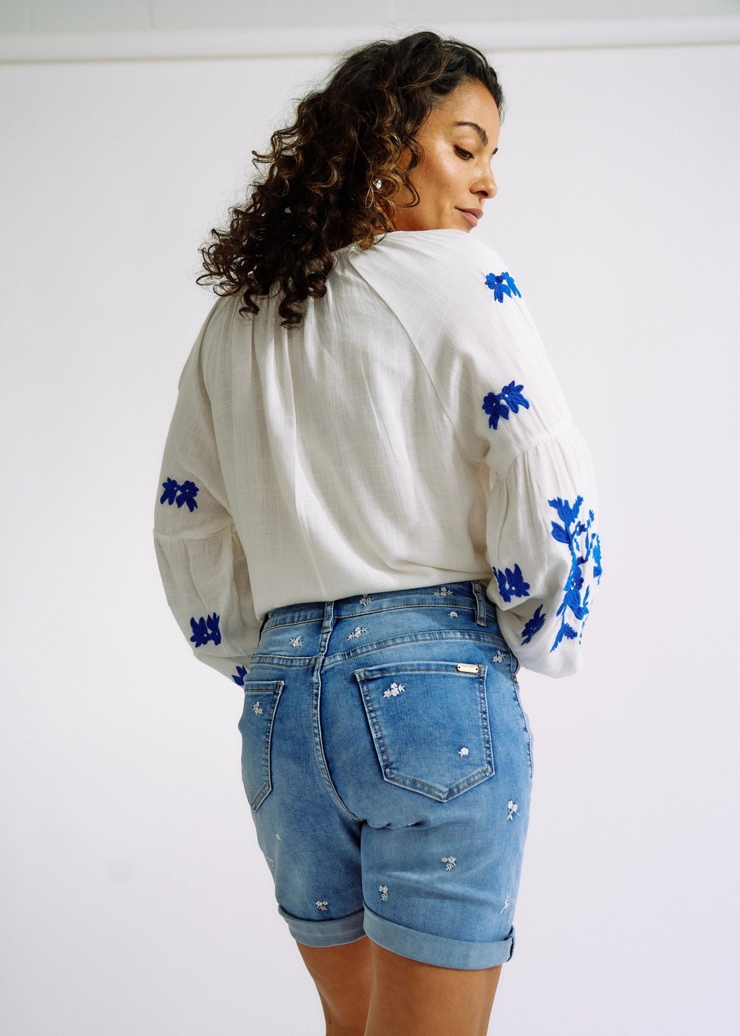 View our Linen Blend Peasant Blouse with Navy Embroidery - The ultimate TOPS created by TRIBUTE and sold here, at Tribute Store