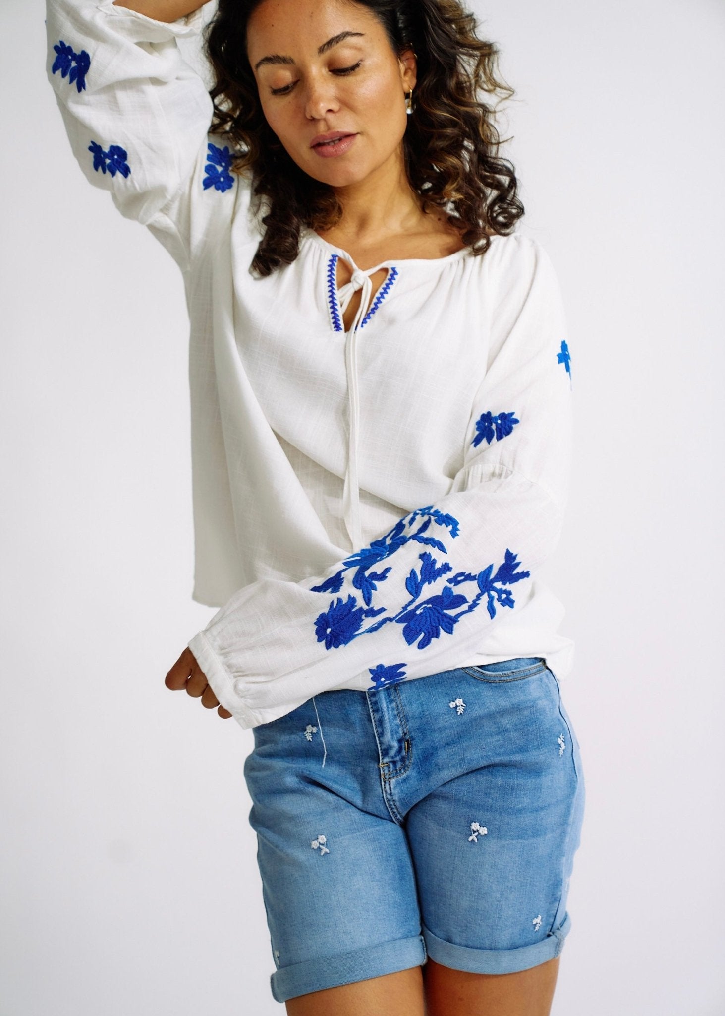 View our Linen Blend Peasant Blouse with Navy Embroidery - The ultimate TOPS created by TRIBUTE and sold here, at Tribute Store