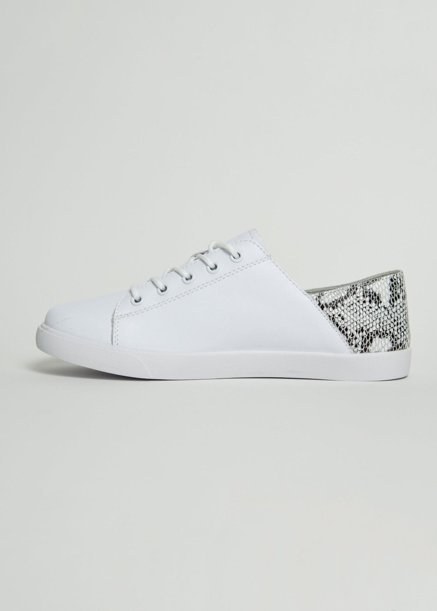 View our Nicki Snake Print Sneaker In White - The ultimate SHOES created by Julz and sold here, at Tribute Store