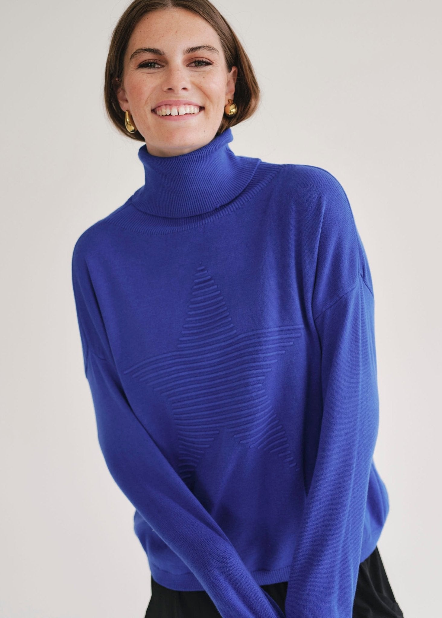 View our Bastille Royal Blue Polo Neck Knit with Star Front - by Tribute Store