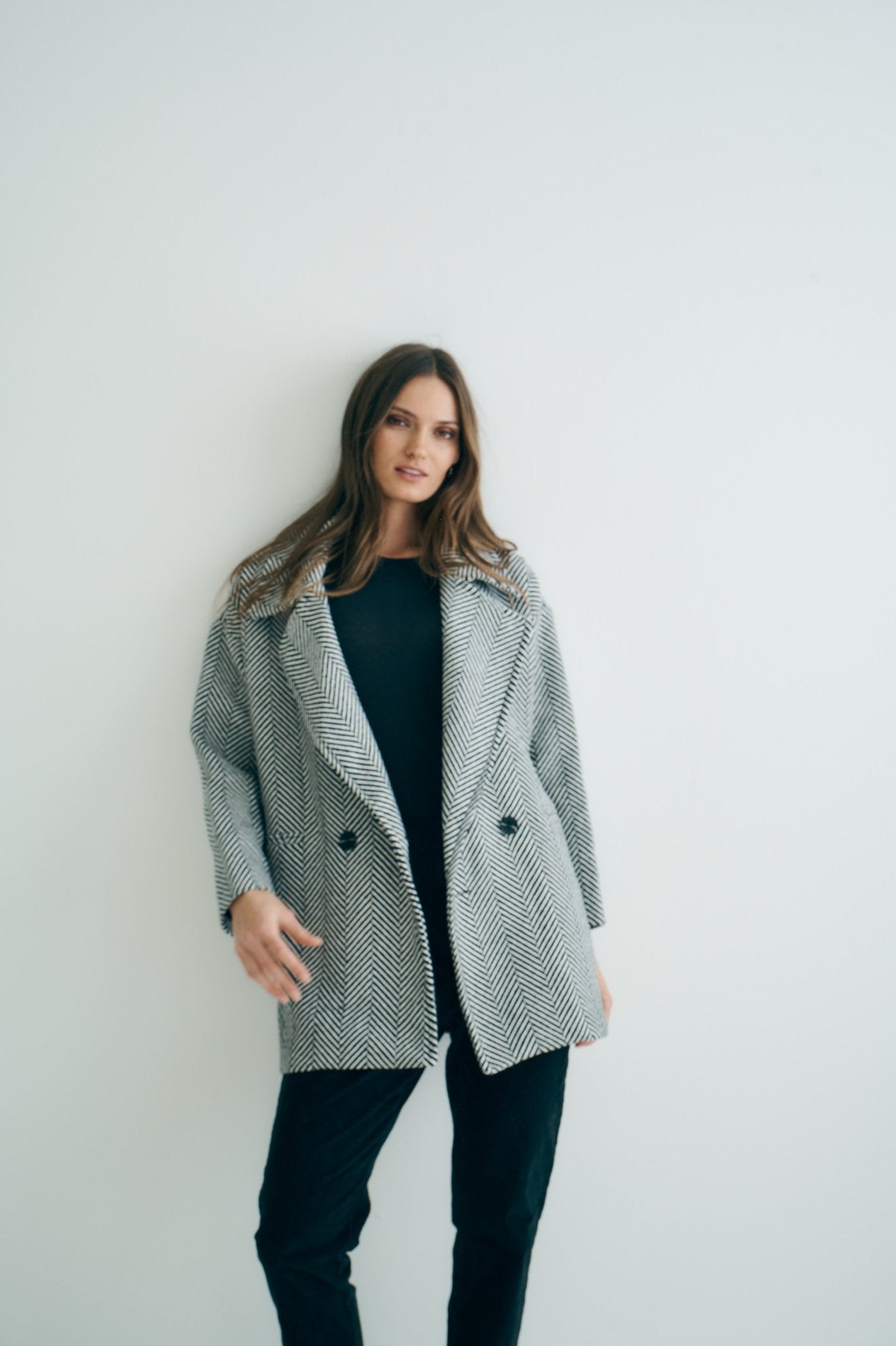 View our Bordeaux Wool Coat in Black and White - by Tribute Store