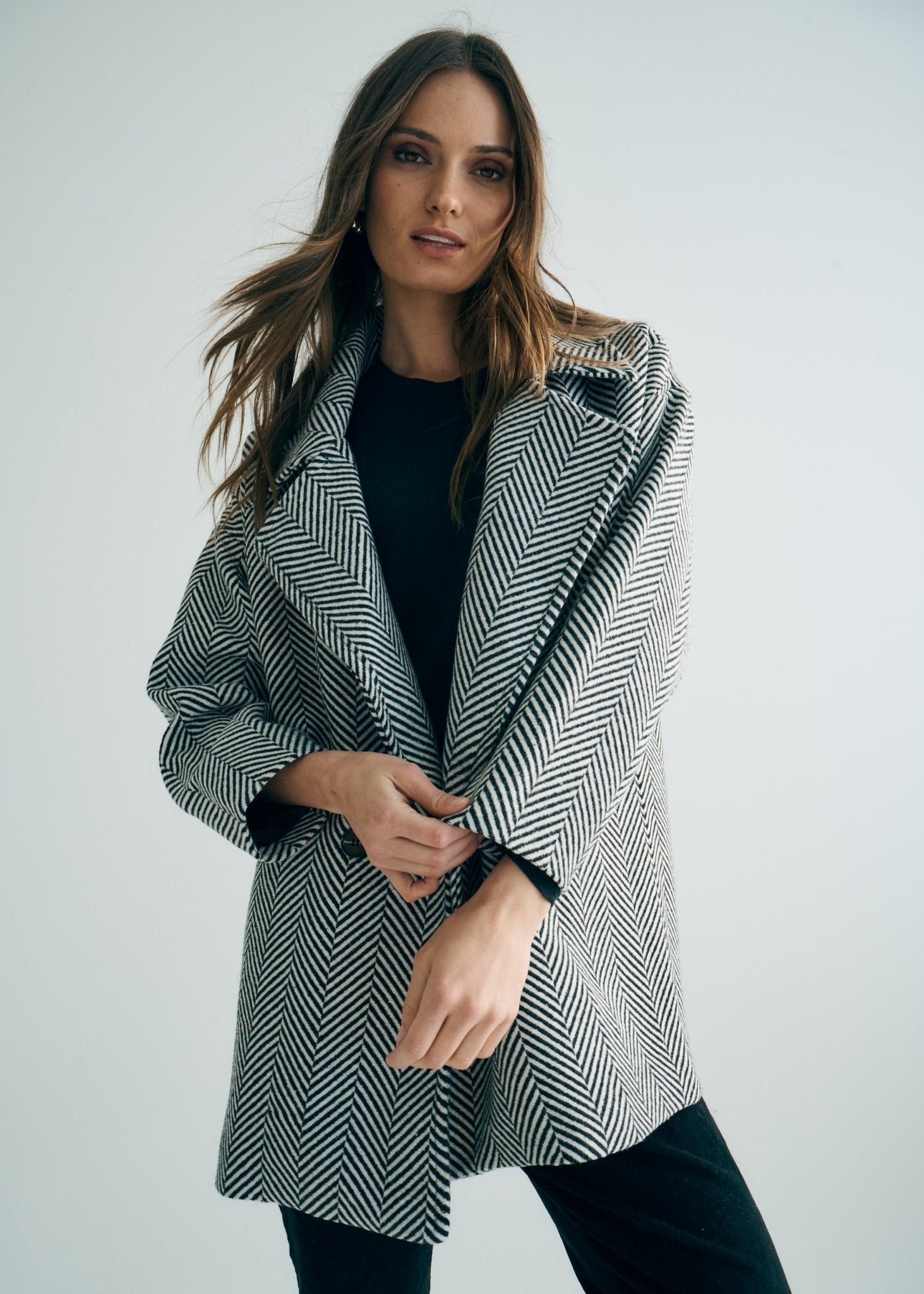 View our Bordeaux Wool Coat in Black and White - by Tribute Store