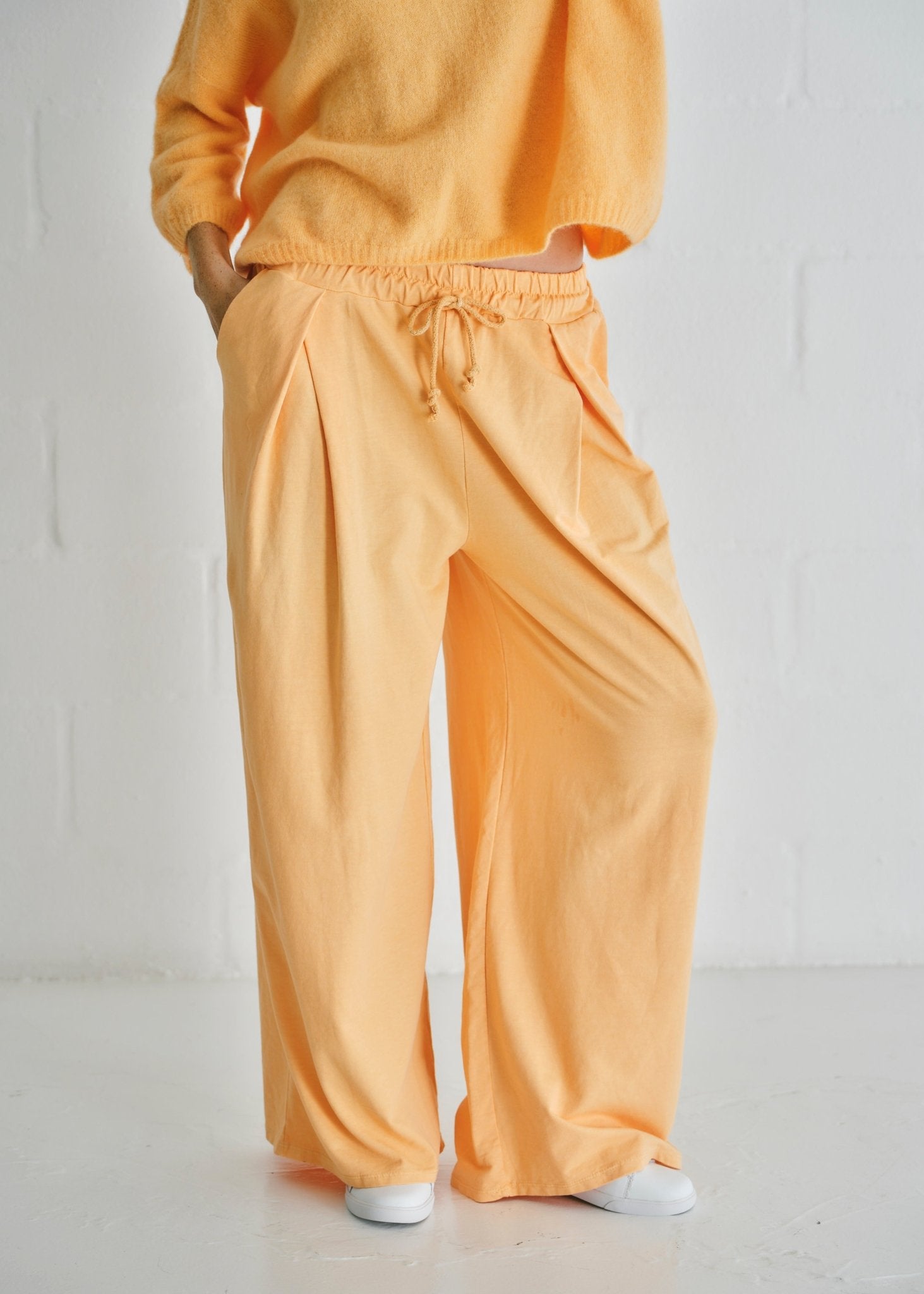 View our Calabria Italian Wide Leg Tracksuit Pants In Apricot - by Tribute Store