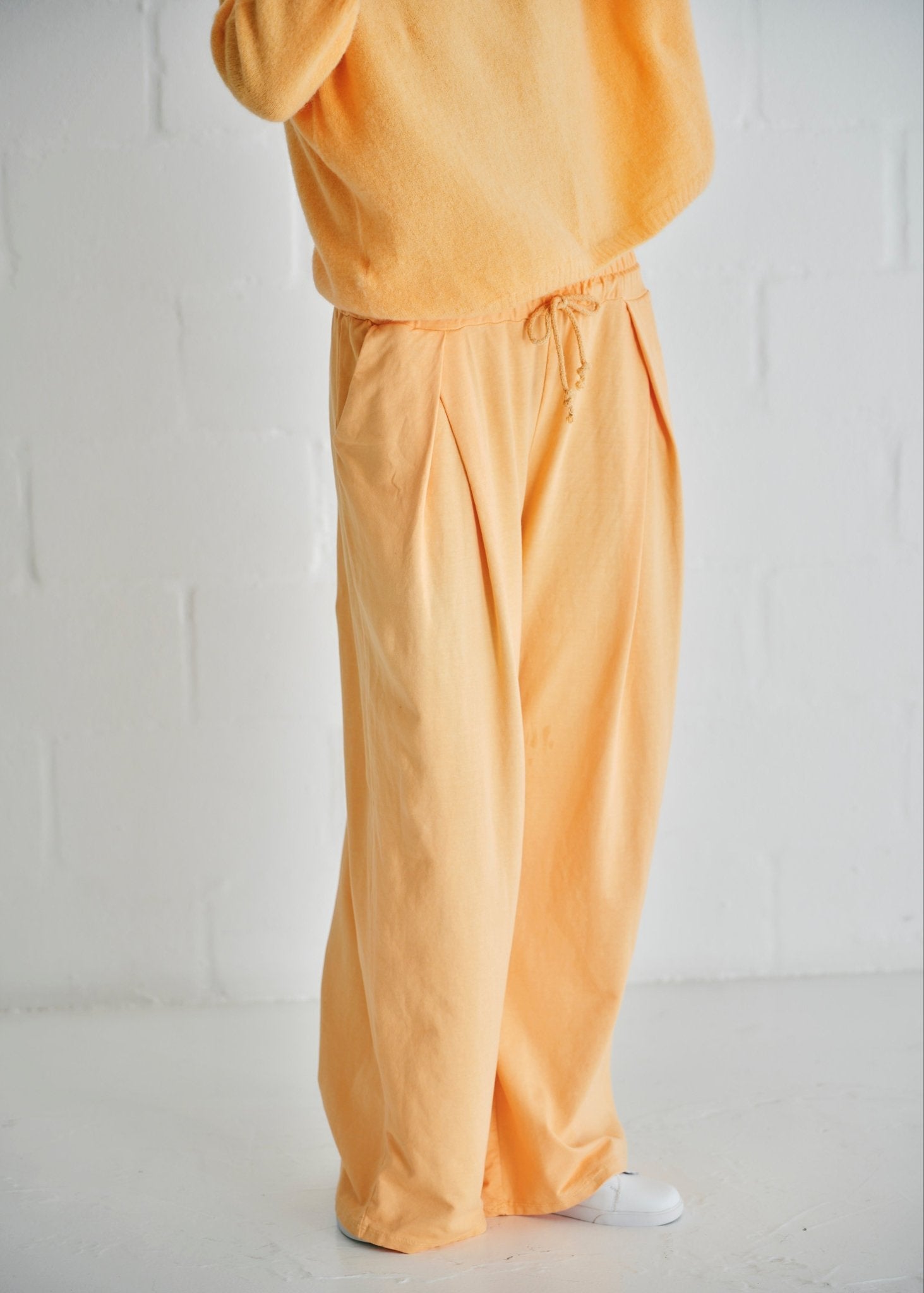 View our Calabria Italian Wide Leg Tracksuit Pants In Apricot - by Tribute Store