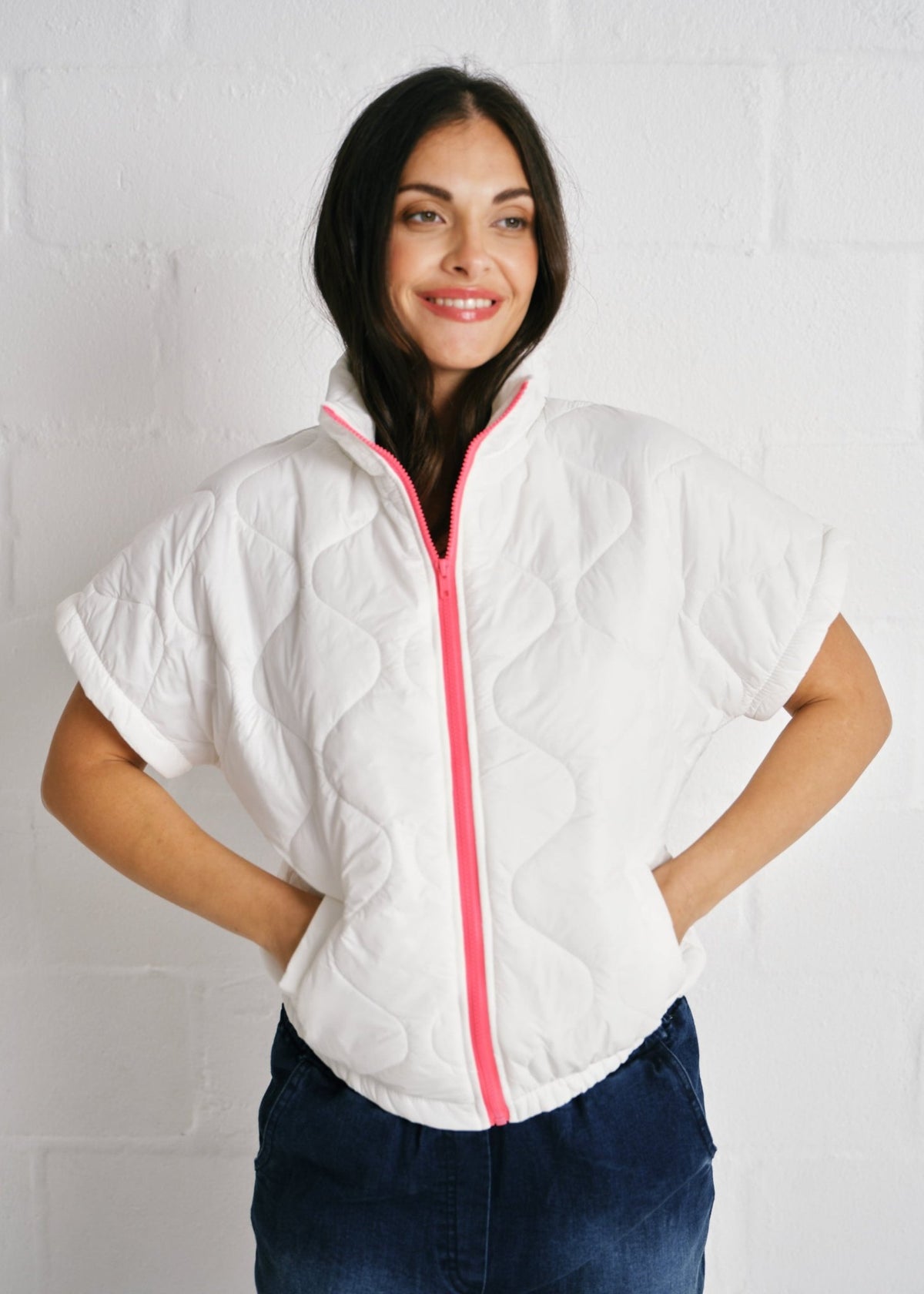 View our Cortina Quilted Short Sleeve Puffer Jacket With Pink Zip In White - by Tribute Store