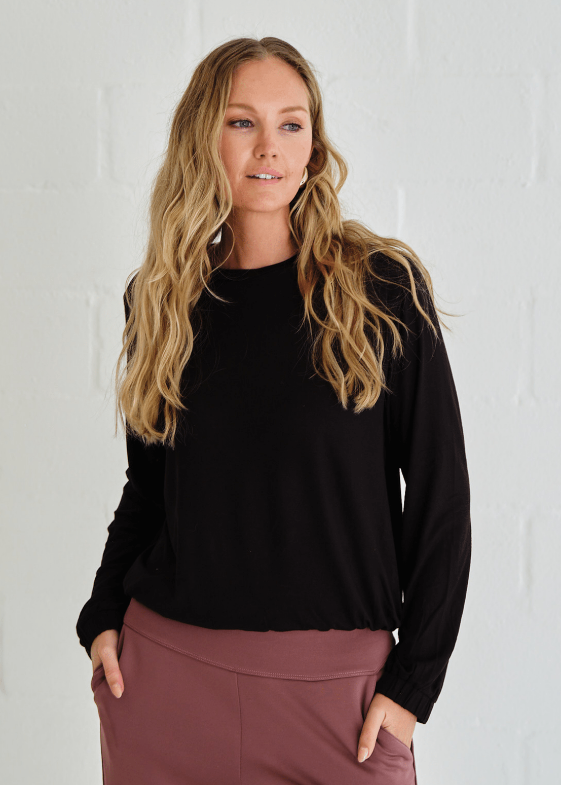 View our Eve Elasticated Hem Top In Black - by Tribute Store