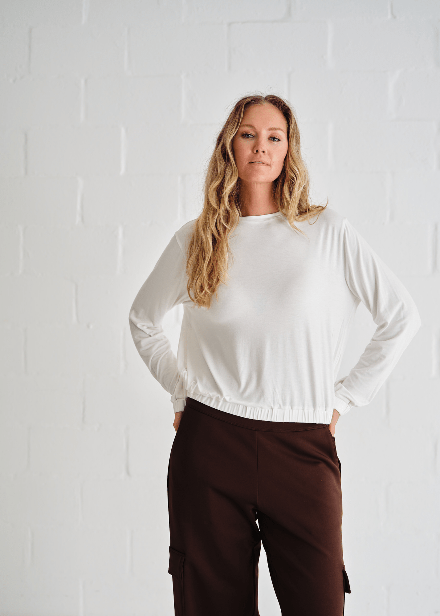 View our Eve Elasticated Hem Top In White - by Tribute Store