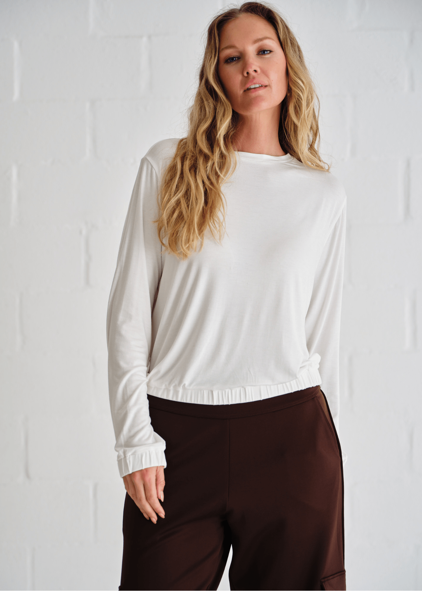 View our Eve Elasticated Hem Top In White - by Tribute Store