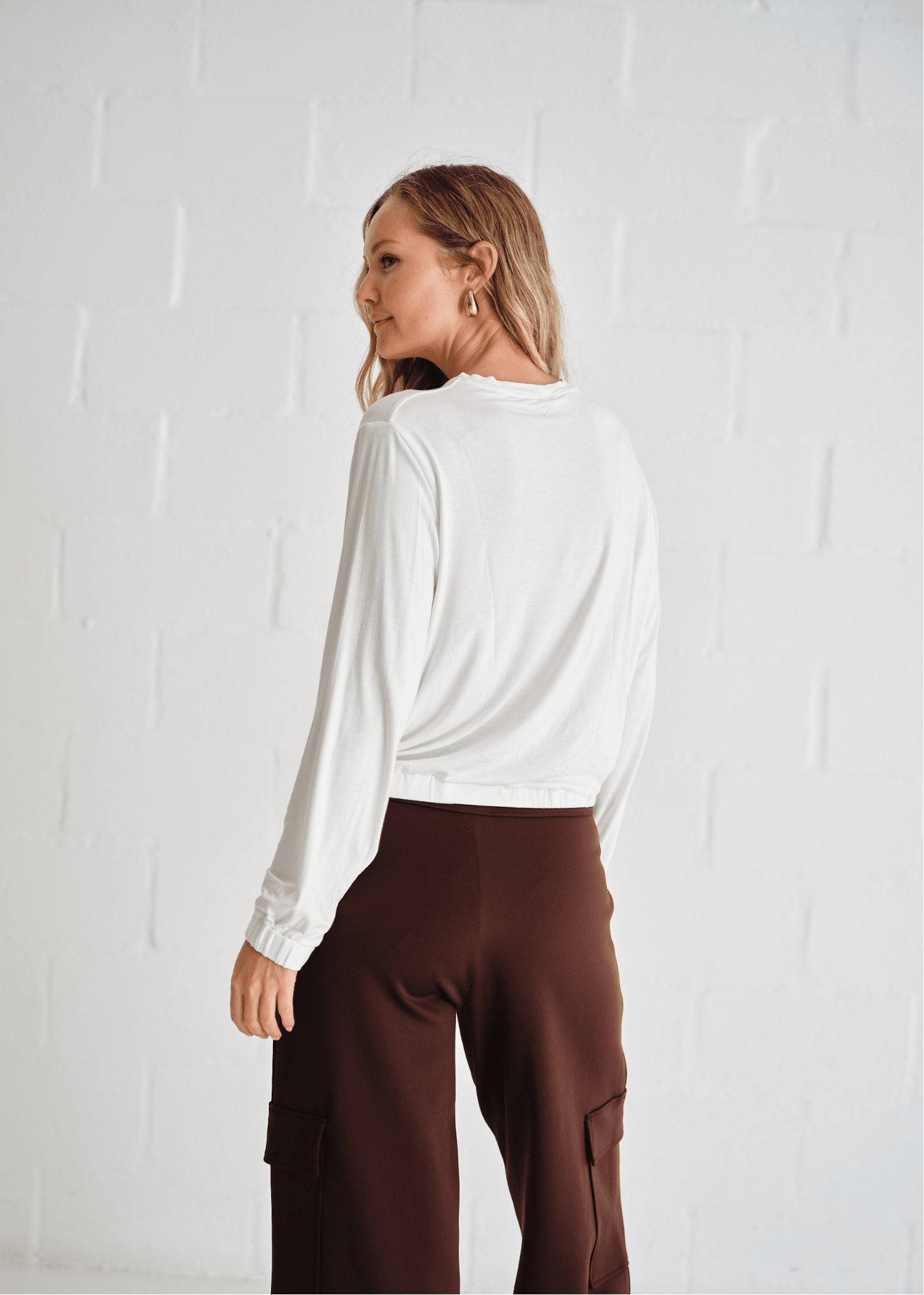 View our Eve Elasticated Hem Top In White - by Tribute Store