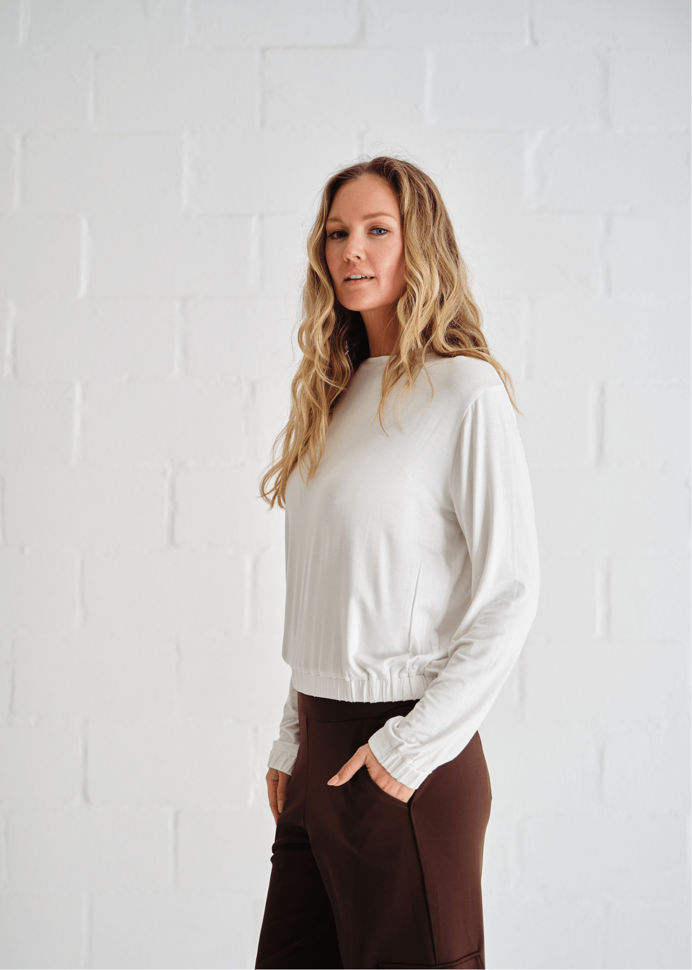 View our Eve Elasticated Hem Top In White - by Tribute Store