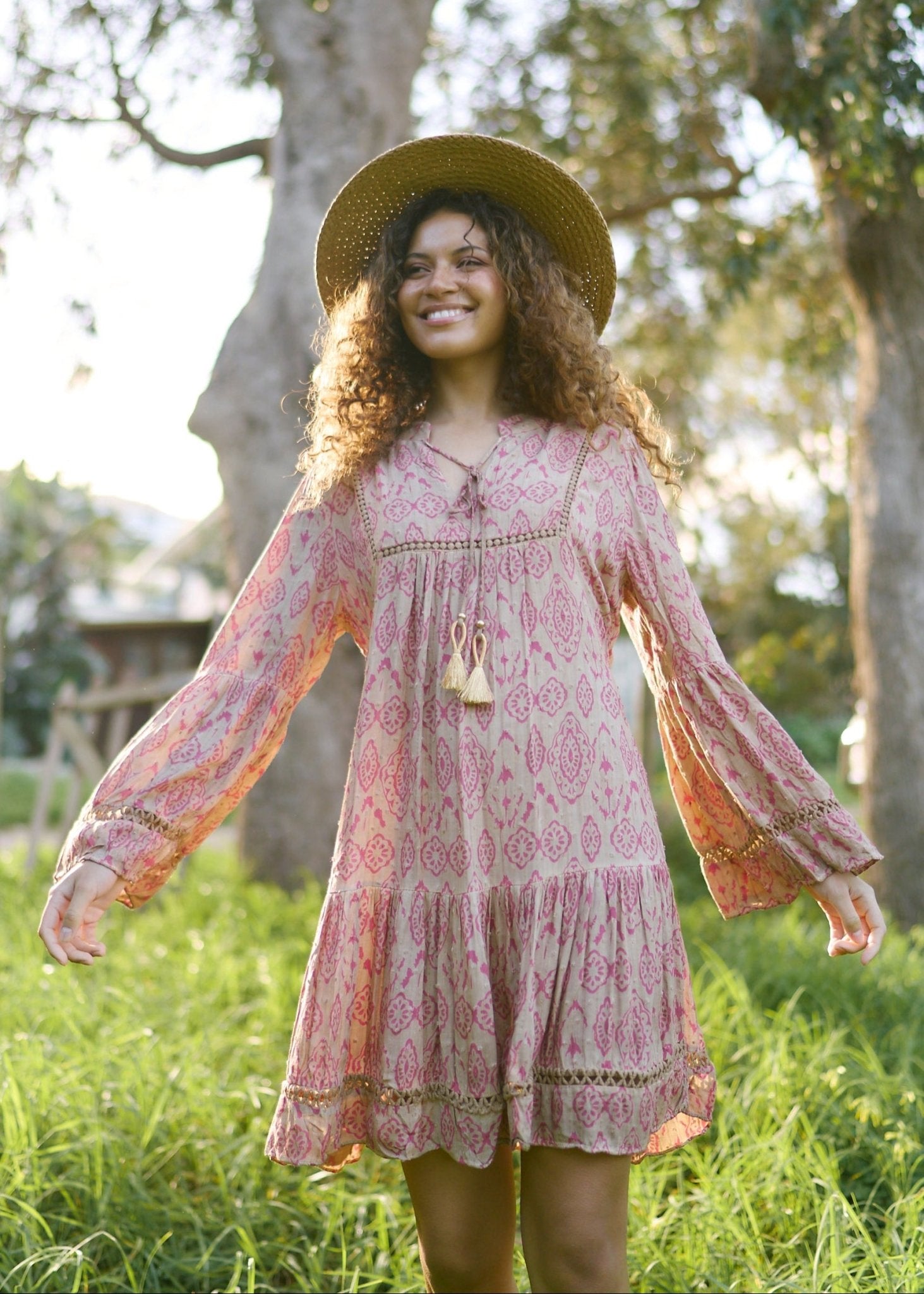View our Helena Short Bohemian Dress with Tassels in Pink Print - by Tribute Store