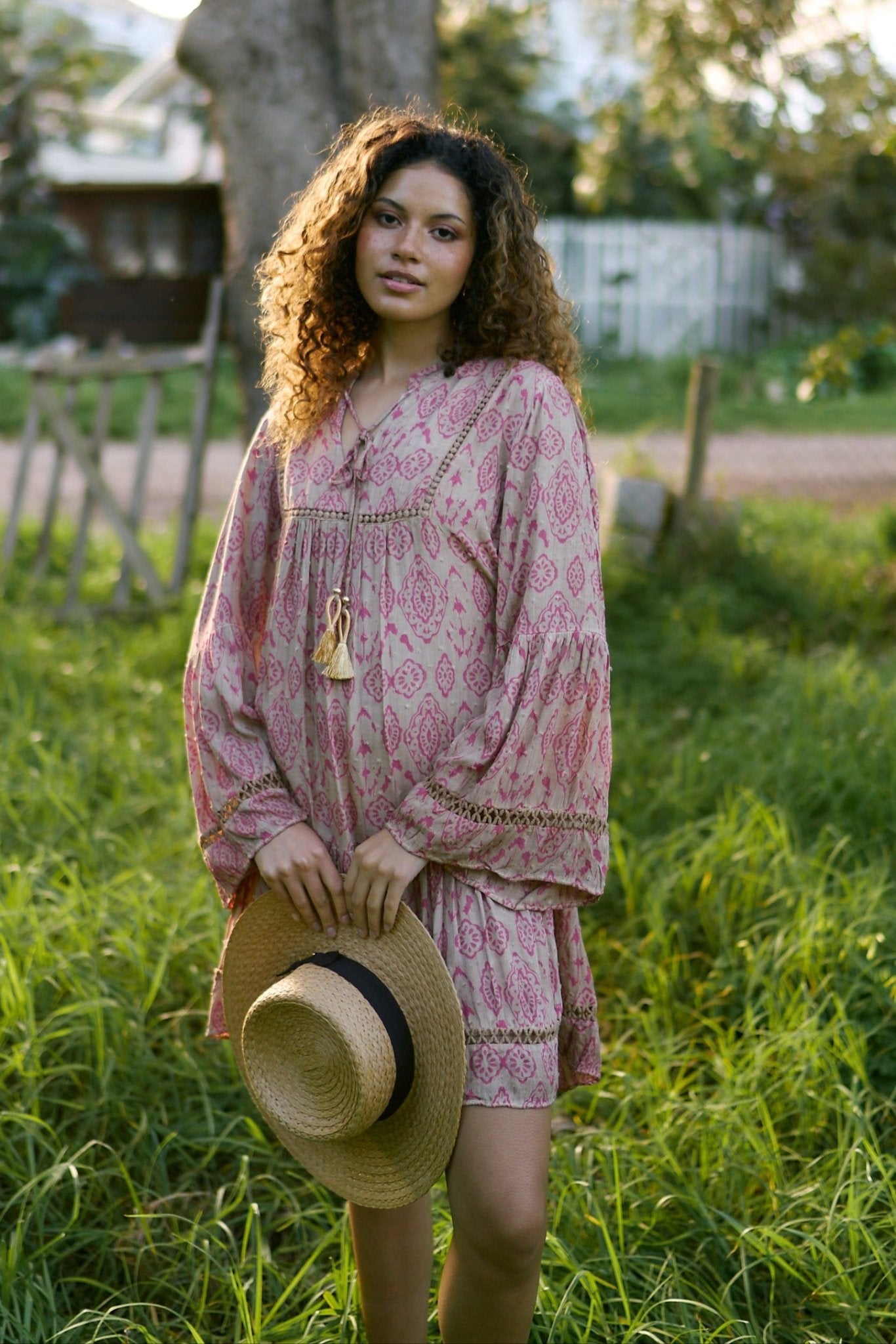 View our Helena Short Bohemian Dress with Tassels in Pink Print - by Tribute Store