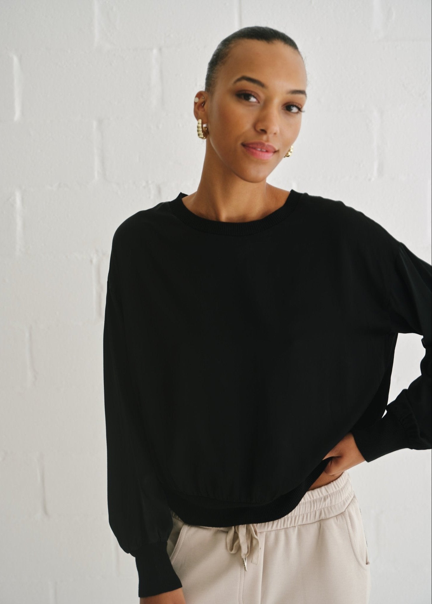 View our Italian Crew Neck Satin Long Sleeved Top In Black - by Tribute Store