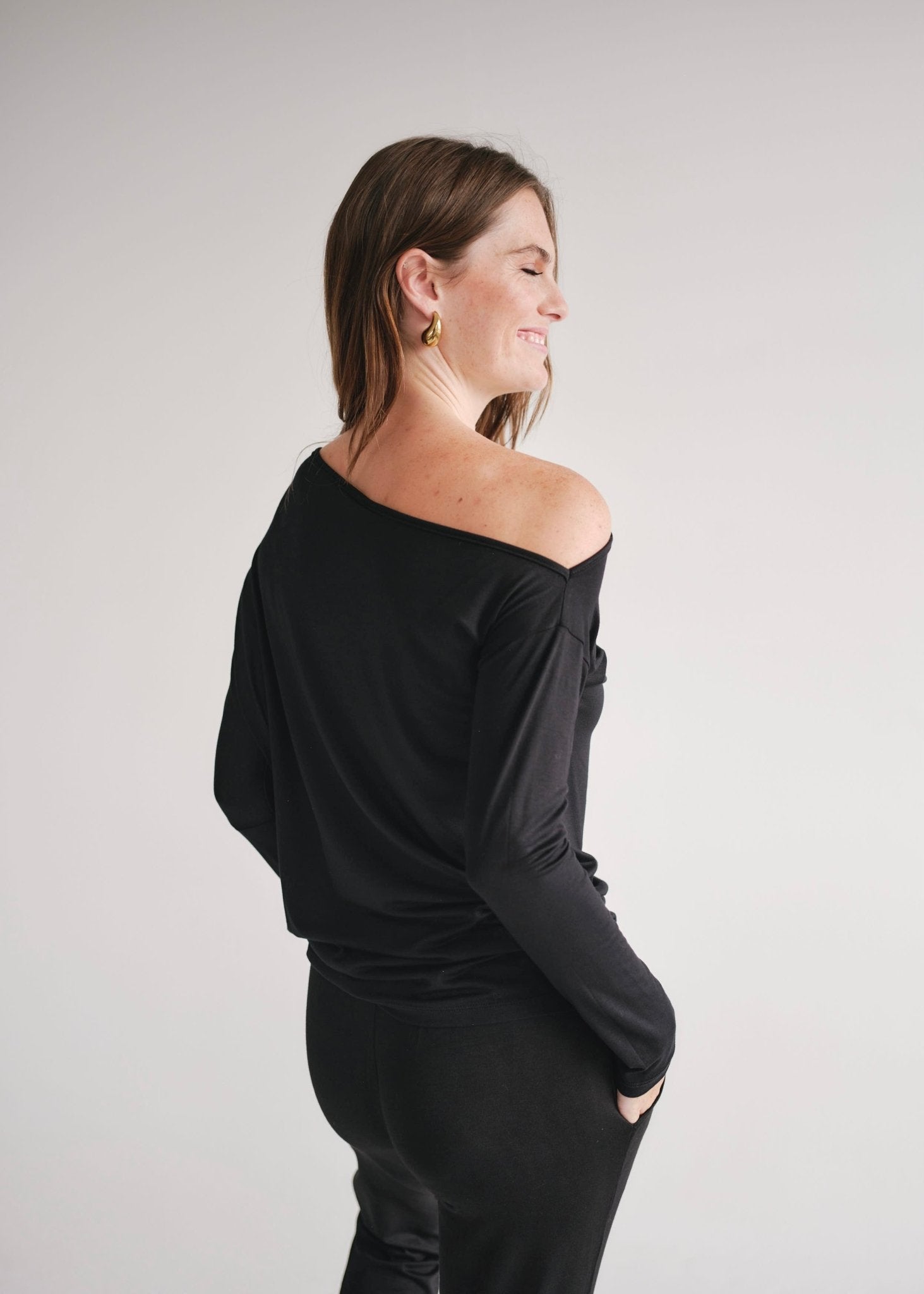 View our Long Sleeved Off The Shoulder Classic Top In Black - by Tribute Store