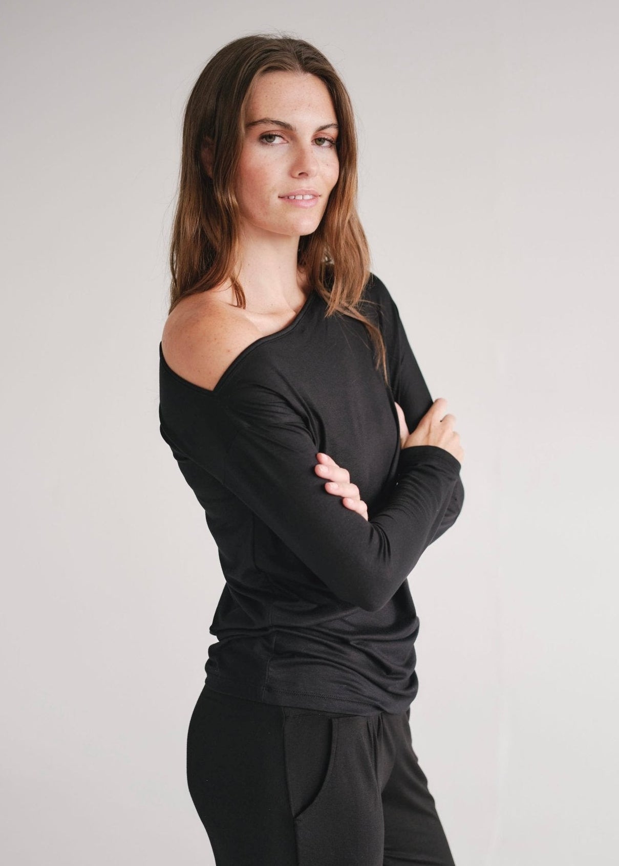 View our Long Sleeved Off The Shoulder Classic Top In Black - by Tribute Store