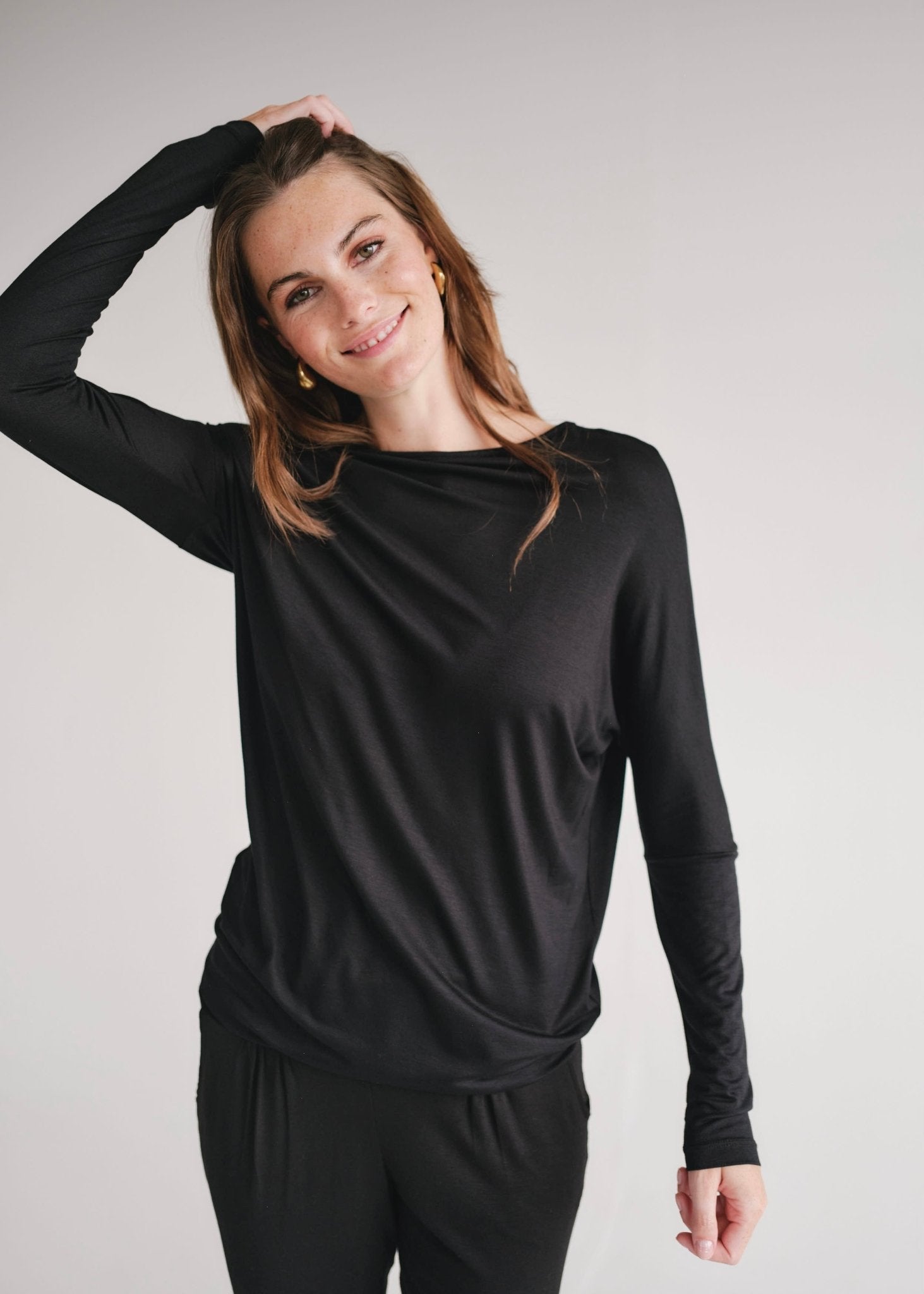 View our Long Sleeved Off The Shoulder Classic Top In Black - by Tribute Store