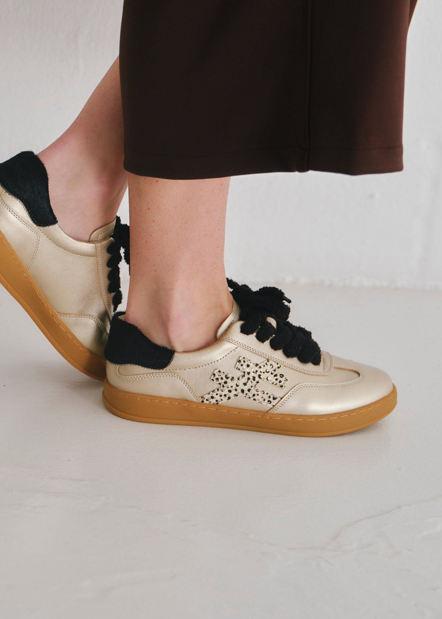 View our Lumi Leather Sneaker With Cheetah Print In Gold And Black - by Tribute Store