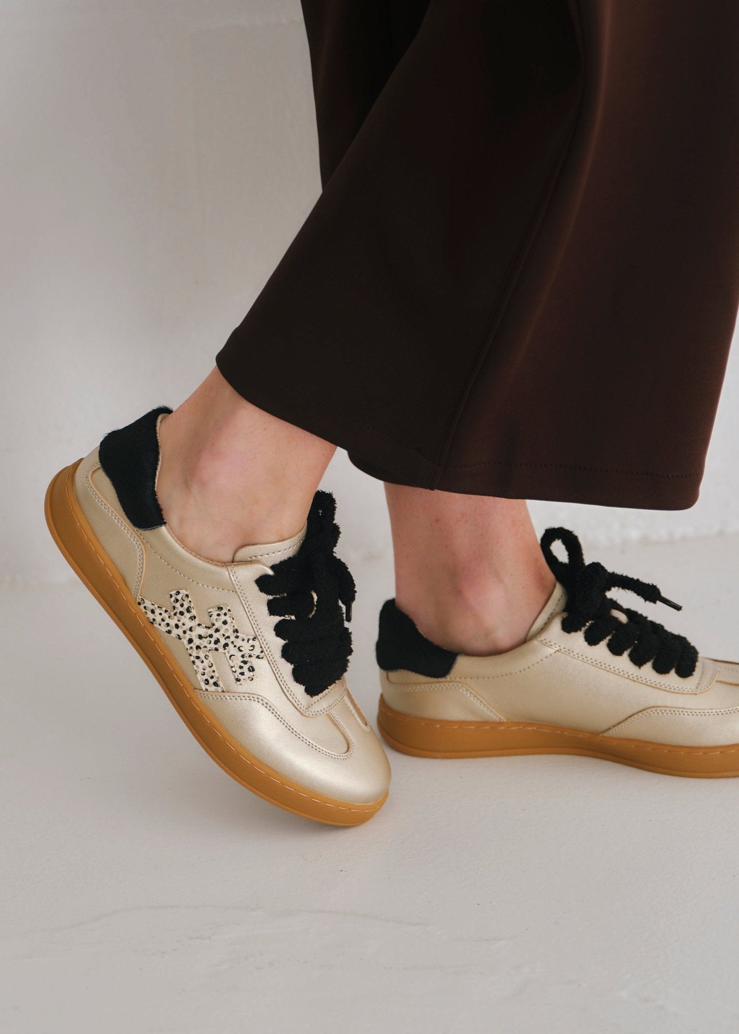 View our Lumi Leather Sneaker With Cheetah Print In Gold And Black - by Tribute Store