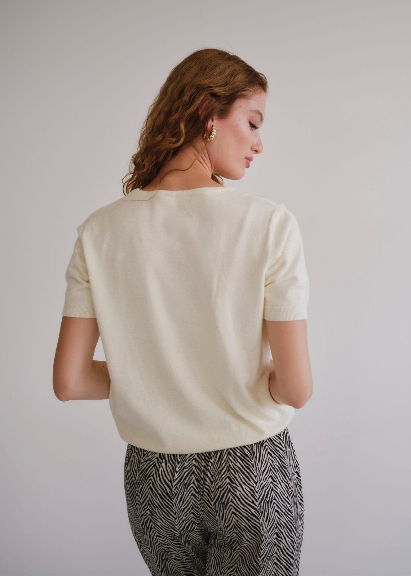 View our Lurex V Neck Tee with Shimmer Detail in Cream - by Tribute Store