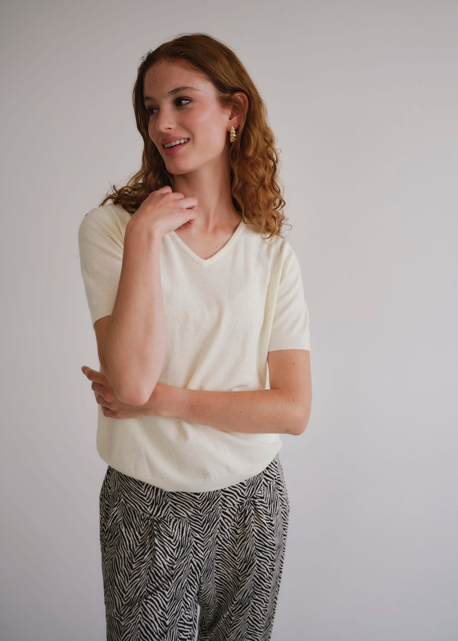 View our Lurex V Neck Tee with Shimmer Detail in Cream - by Tribute Store