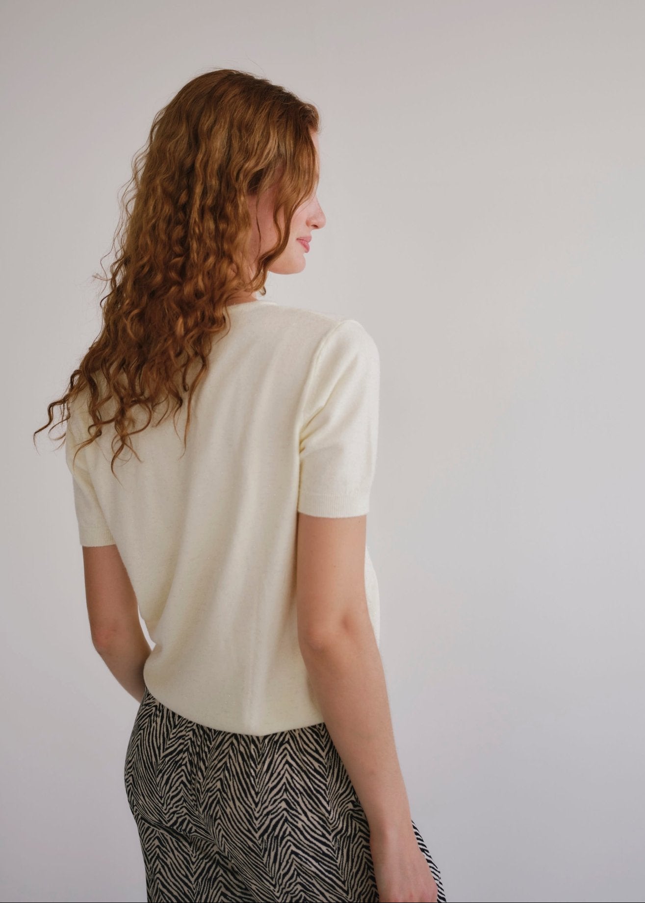 View our Lurex V Neck Tee with Shimmer Detail in Cream - by Tribute Store