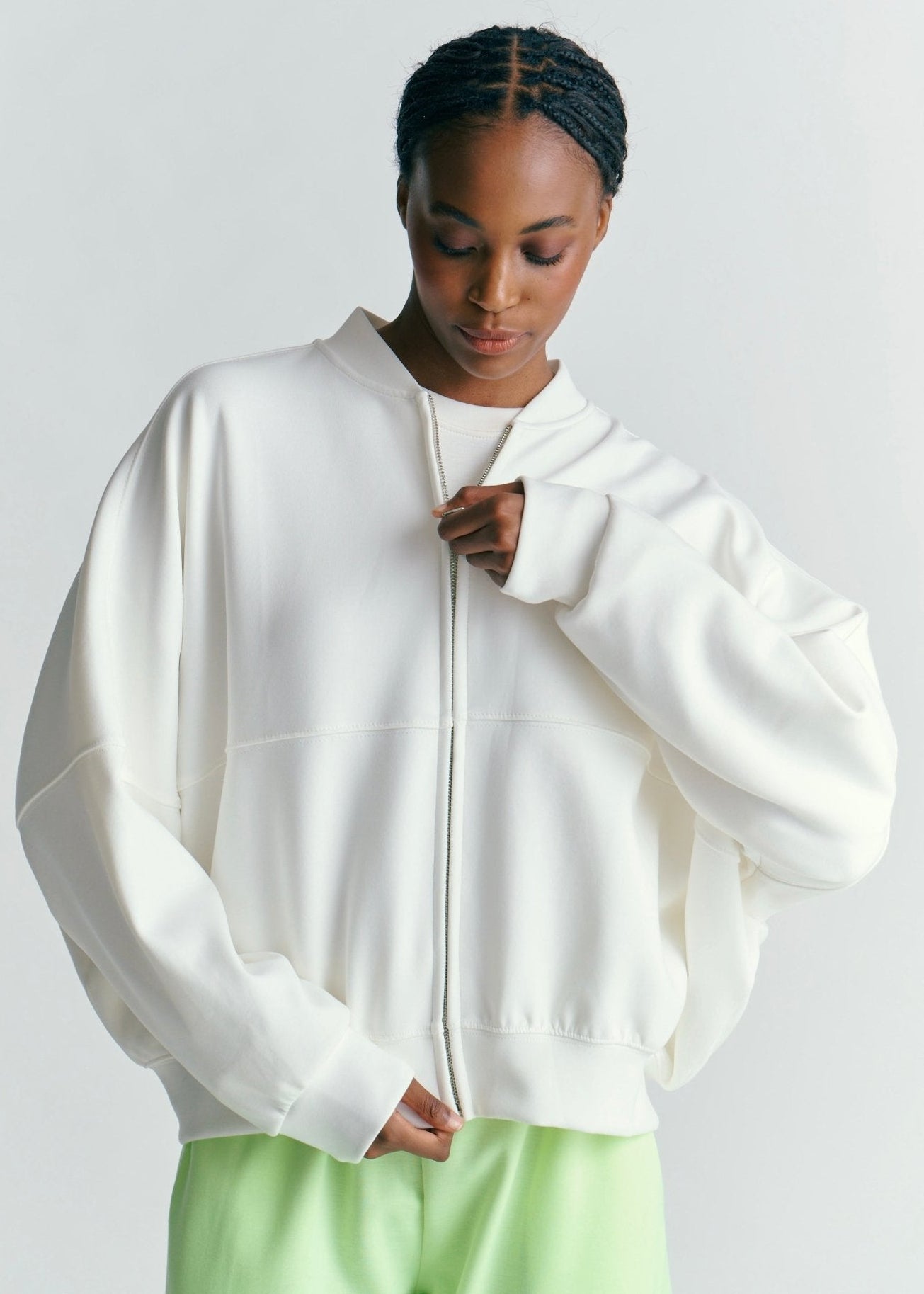 View our Malmö Oversized Zip Up Bomber Jacket In White - by Tribute Store