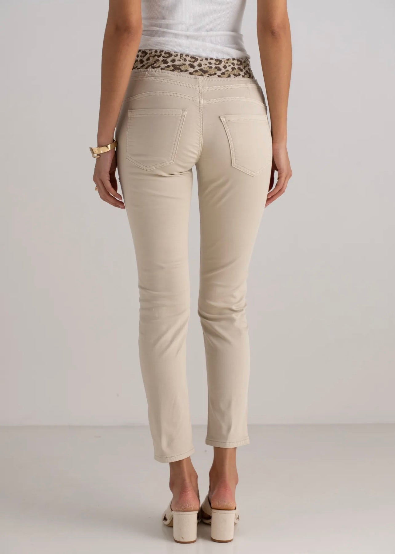 View our Mid - Rise Cotton Jogger Jeans in Beige with Animal Print Waist Band - by Tribute Store