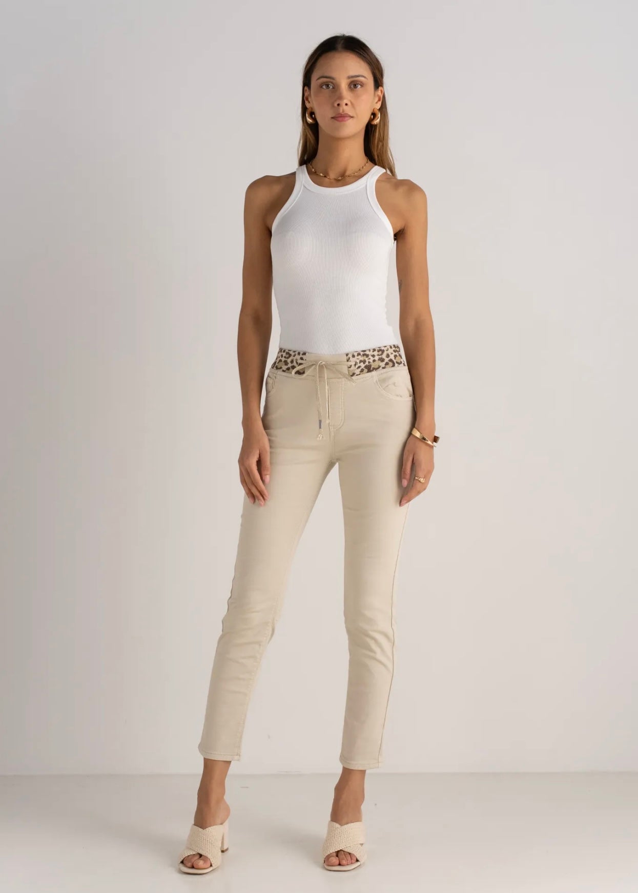 View our Mid - Rise Cotton Jogger Jeans in Beige with Animal Print Waist Band - by Tribute Store