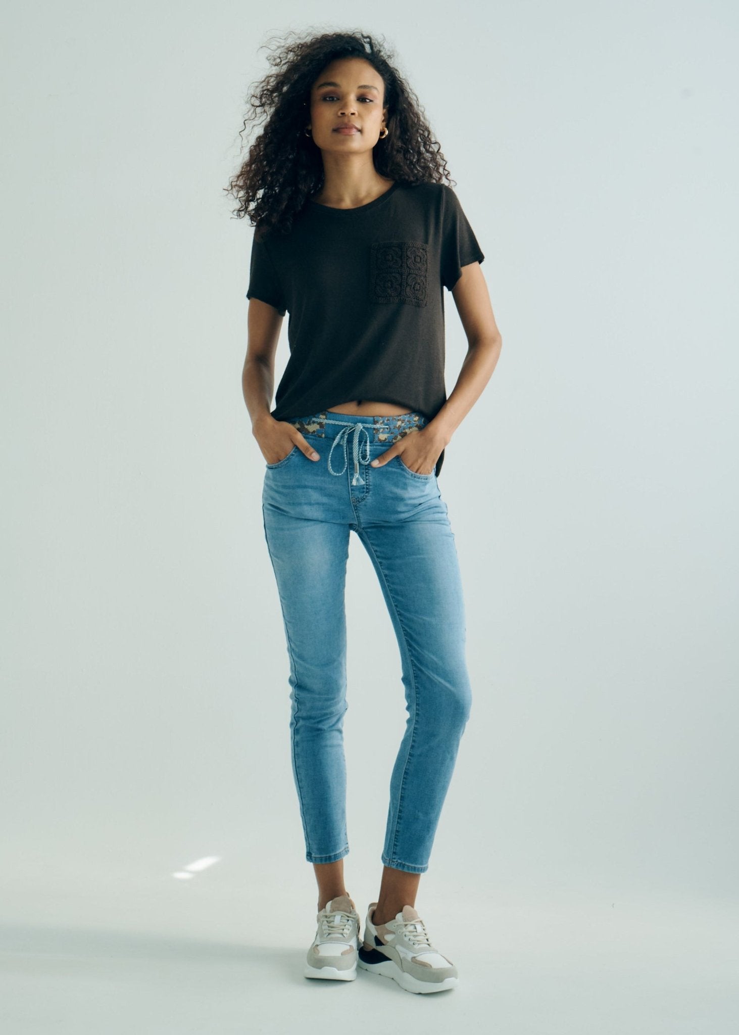 View our Mid - Rise Cotton Jogger Jeans in Blue with Animal Print Waist Band - by Tribute Store