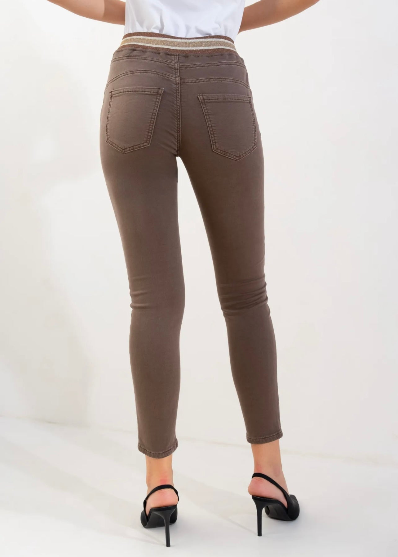 View our Mid - Rise Cotton Jogger Jeans in Chocolate with Gold Waist Band - by Tribute Store