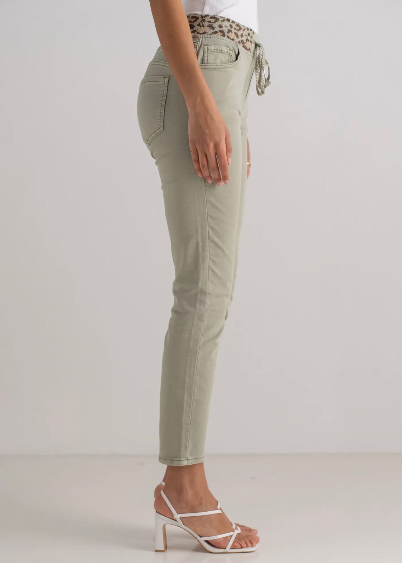 View our Mid - Rise Cotton Jogger Jeans in Khaki with Animal Print Waist Band - by Tribute Store