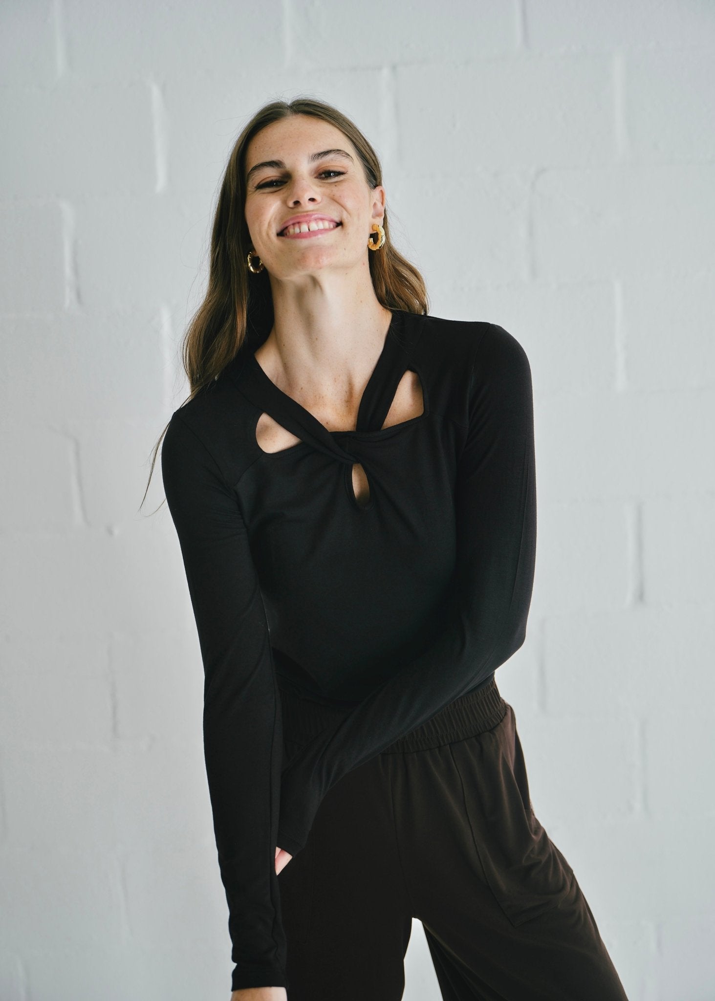 View our Milla Twisted Cut - Out Long Sleeve Top Black - by Tribute Store