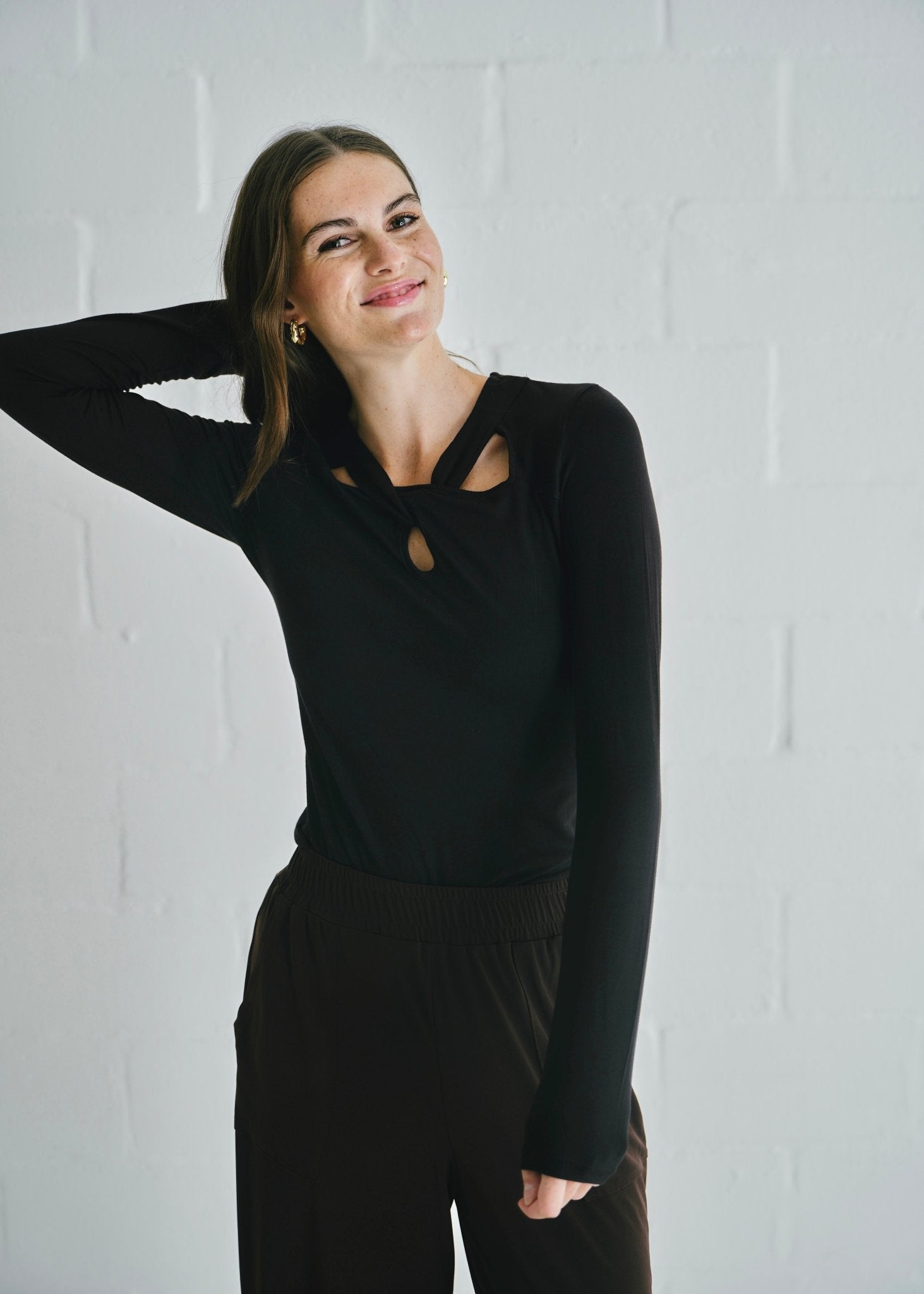 View our Milla Twisted Cut - Out Long Sleeve Top Black - by Tribute Store