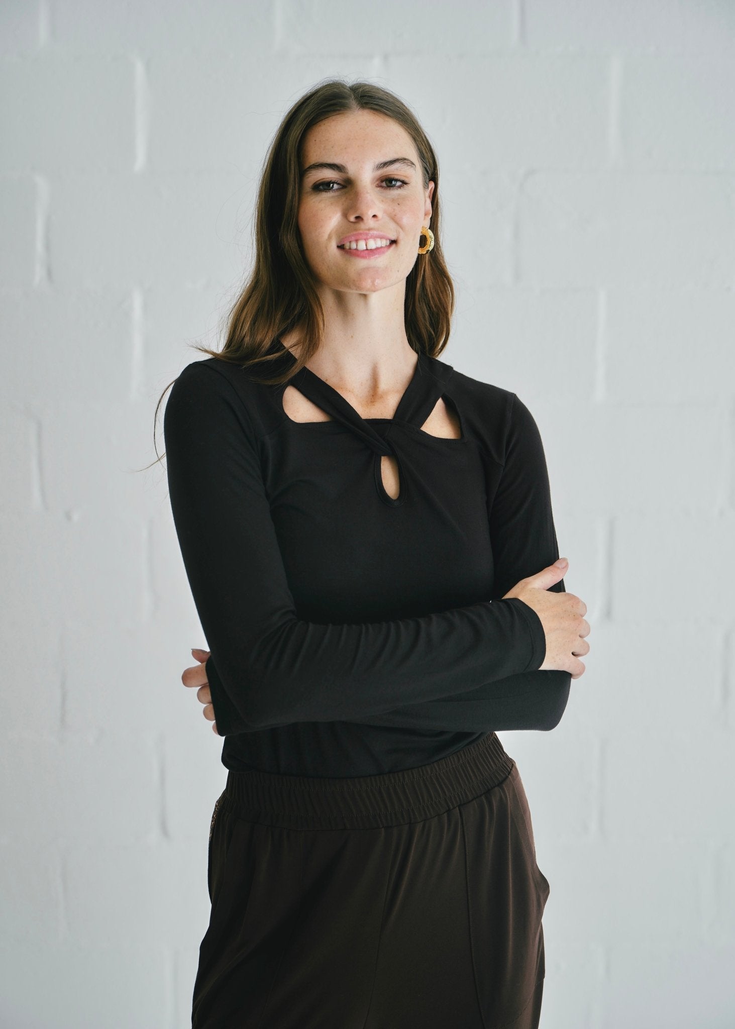 View our Milla Twisted Cut - Out Long Sleeve Top Black - by Tribute Store