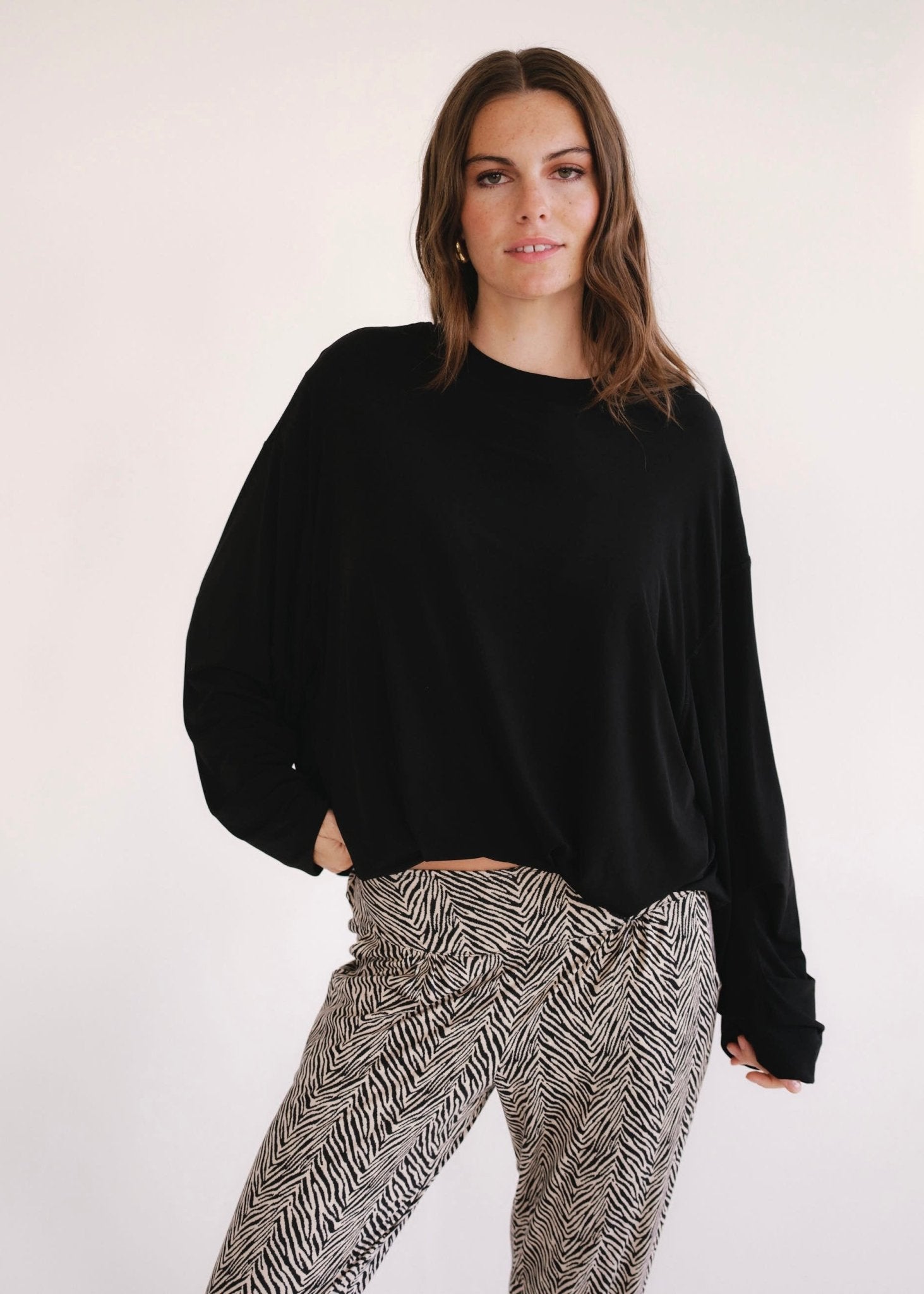View our Oversized Batwing Top In Black - by Tribute Store