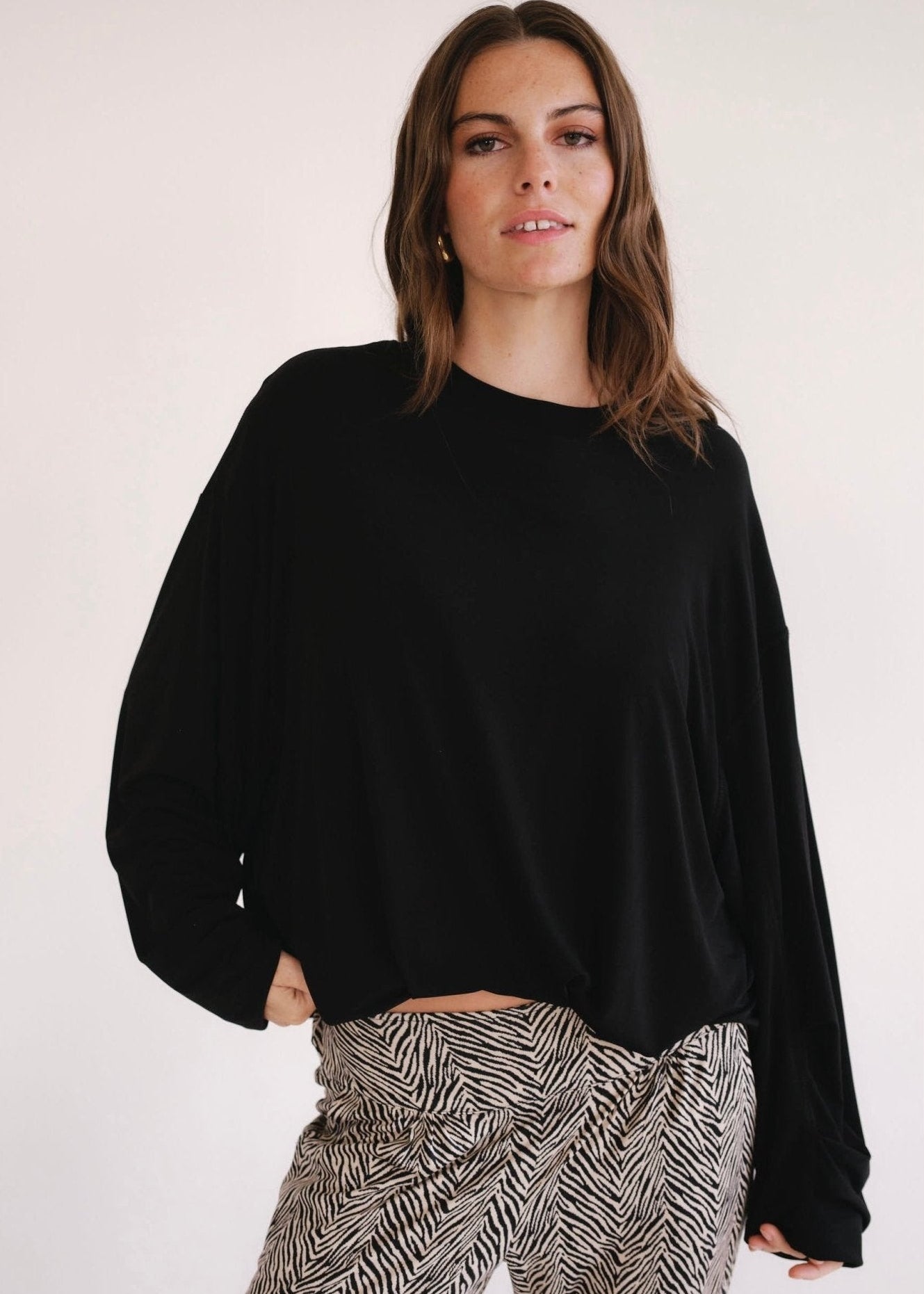 View our Oversized Batwing Top In Black - by Tribute Store