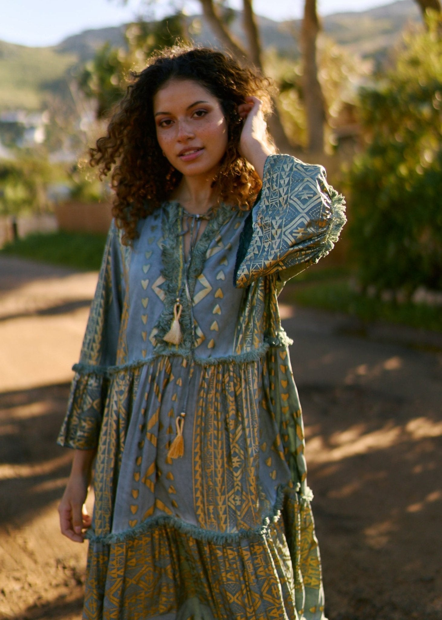 View our Phoebe Maxi Bohemian Dress with Front Tassels in Deep Green - by Tribute Store