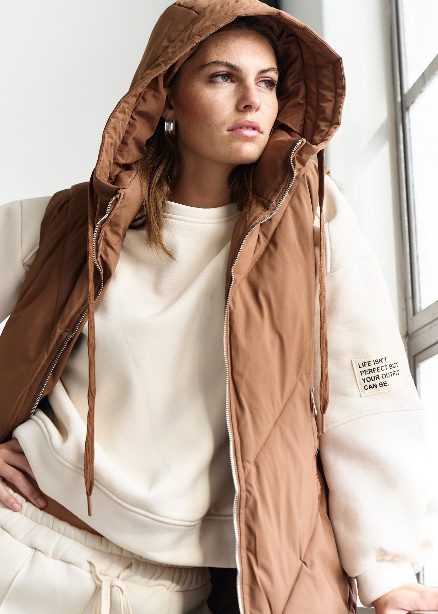 View our Scandi Sleeveless Down Feather Winter Puffer Jacket in Coffee - by Tribute Store